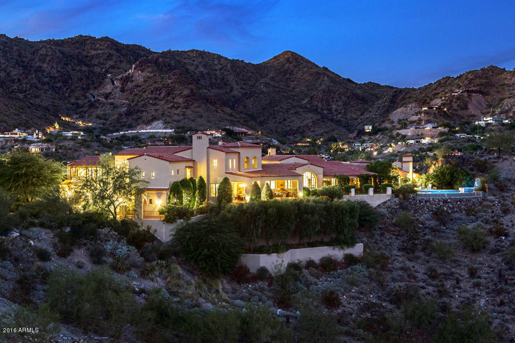 A spectacular estate w/timeless elegance & endless views! This light & bright home, designed to reflect 1920s Spanish Colonial Revival style, was meticulously planned & built over 5 years. No detail is overlooked, from arched doors & windows framing views in every room to hand-cut terracotta tiles that extend from the front courtyard to the interior of the home. Period architecture blends harmoniously w/ modern finishes to provide an unrivaled luxury lifestyle. A gourmet kitchen w/ high-end appliances & a butler’s pantry will delight any chef, while multiple covered patios, a negative-edge pool & spa w/ breathtaking views are perfect for entertaining. The main-level master wing is a true retreat, & the exceptionally appointed en-suite BRs and casita offer room for all your favorite guests.