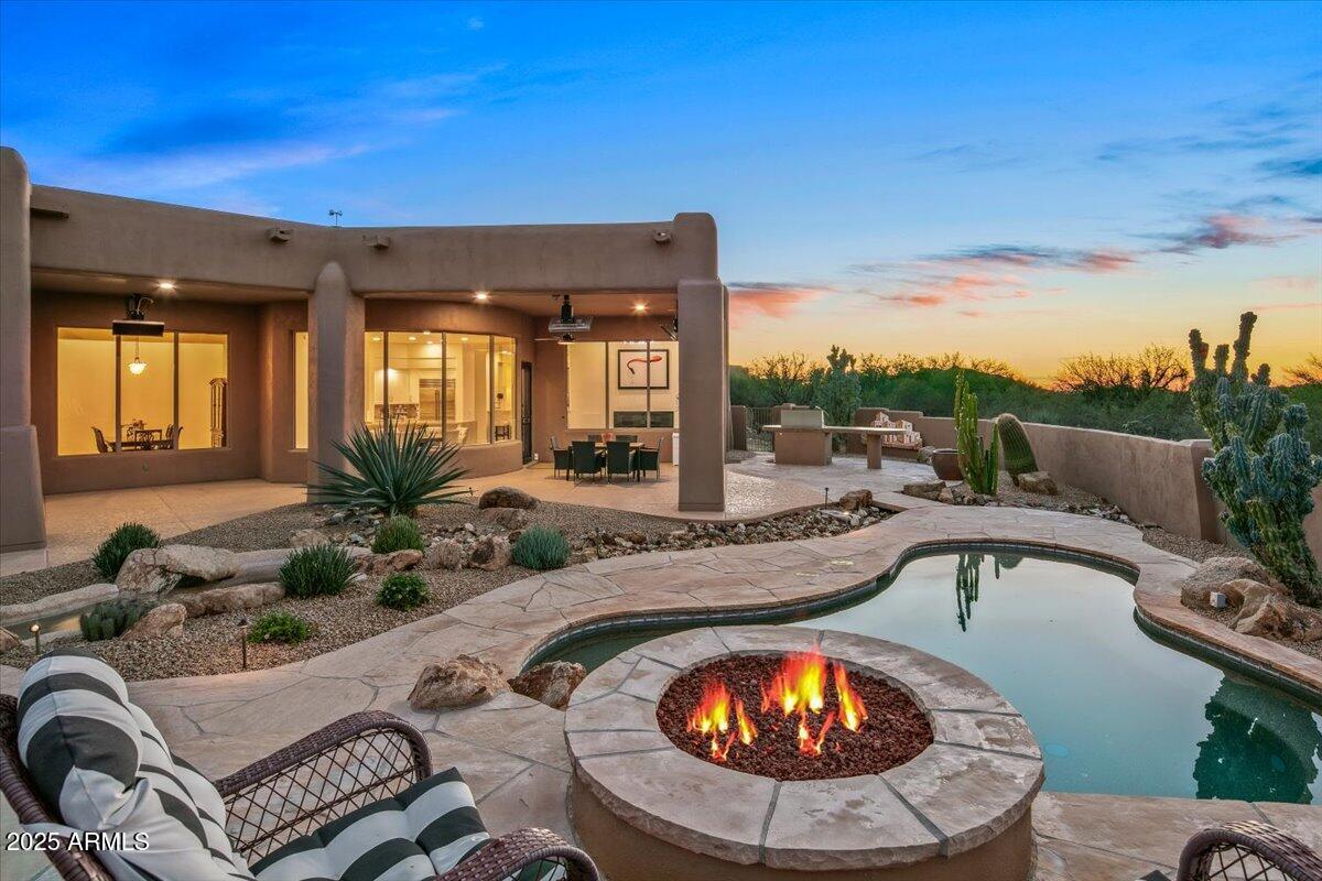 GOLF MEMBERSHIP AVAILABLE!  This well maintained Desert Mountain home offers stunning mountain views, sunsets  and an ideal blend of comfort, style, and functionality. Light and bright throughout, the residence features true single-level living with three en-suite bedrooms plus a dedicated study. Wonderful kitchen which opens to a great room. Outdoor living shines with expansive covered patios, built-in heaters, a sparkling pool/spa, fire pit, and BBQ--perfect for year-round enjoyment. Conveniently located just minutes from the Desert Mountain front gates, the home provides easy access to everything the community offers.  The owners have already completed the design process for an approximately 750 sq ft guest casita, giving the next buyer a fantastic opportunity for added living space. roof, new AC units, a fully redesigned kitchen, new appliances, updated bathrooms, new flooring through out and added bonus-dual closets in the Primary Suite.  Truly a must-see!