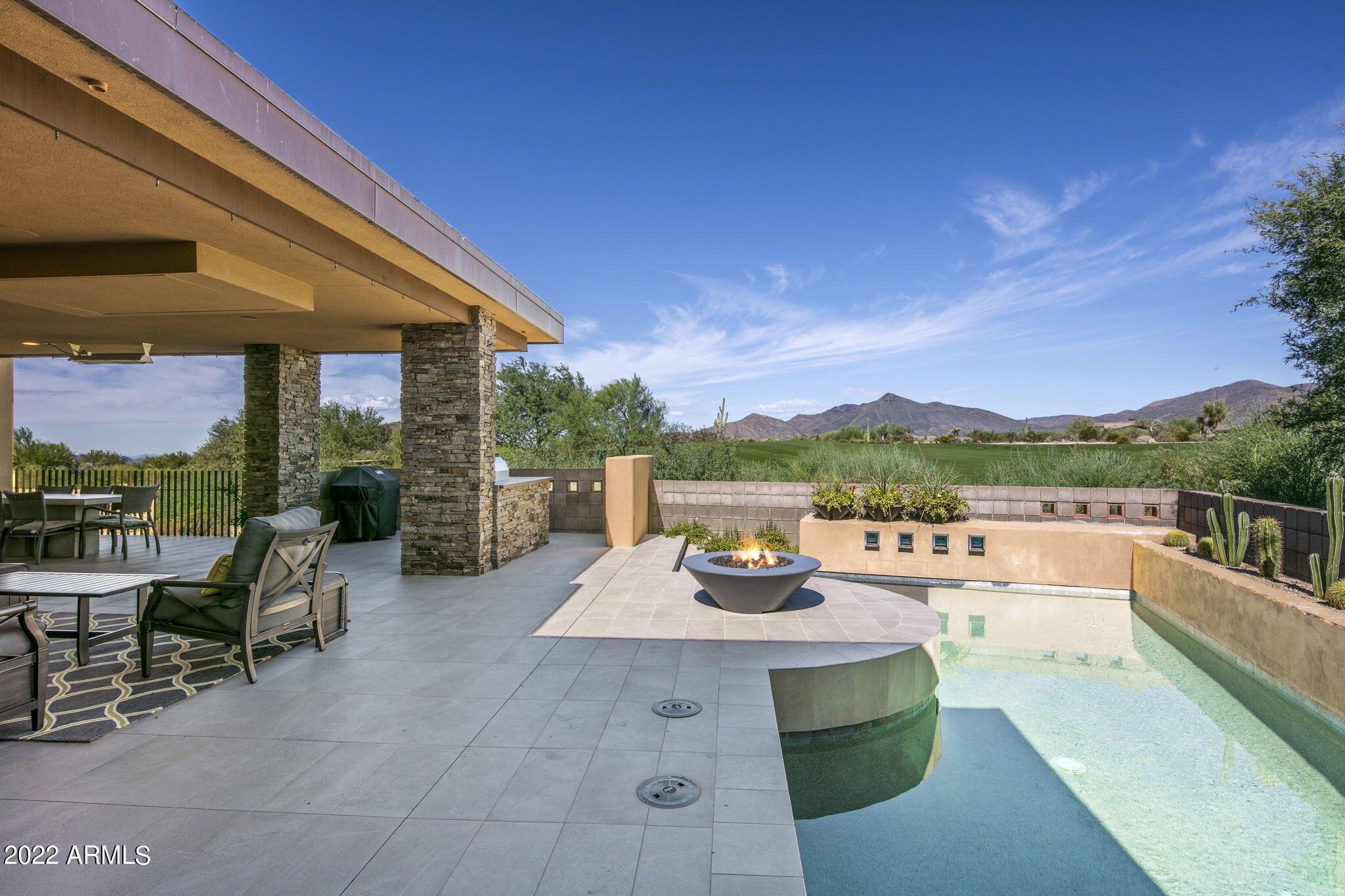 Well appointed Contemporary Larkspur model in Desert Fairways overlooking the 6th hole of Apache Golf Course with stunning mountain views! Completely Remodeled in 2021 by Chris Kitchen with Salero Homes and Interior & Exterior designed  by Hyde Park. This Turnkey split floor plan features unique architectural details throughout with three bedroom, three and a half bath, 3,664 square feet, multiple fireplaces, Gourmet kitchen, Private heated pool, Fire pit, Built in BBQ, and Separate 400 square foot one bedroom Casita.
Seven Membership is available from the Seller to be purchased separately through the Desert Mountain Club. A 30-day Membership application review and approval is required. Please contact the Desert Mountain Club for details. More on Desert Mountain... It is a thirty-four-year-old, 8,200 acre, gated, private golf and outdoor recreation-oriented master planned development on the slopes of the Continental Mountain range on the northern edge of Scottsdale, contiguous to the fourth largest National Forest in the country. There is a twenty-mile private trail system in these mountains for the exclusive use of Desert Mountain residents. The top elevation is 4,890', highest in all of Maricopa County. The views from the high point in the trail system are really something to see! Phoenix Sky Harbor Airport is typically about a forty-minute drive from the community's Front Gate. 

The opportunity to be a member of The Desert Mountain Club is a significant part of the attraction of living in Desert Mountain for most property owners as the Club is the emotional, physical, and social "core" of the place. The Club is rightfully internationally famous as a year 'round, private spa and golf mecca, with seven clubhouses, nine dining venues, six eighteen-hole championship Jack Nicklaus Signature courses, four practice ranges, a high-tech golf performance center, and an eighteen-hole par-3 course, rated for handicap purposes. That course, known as "Seven", has a "sports bar" clubhouse with twenty-eight big screen televisions, two bocce ball courts, and several huge firepits. 

One of the other Clubhouses is the Sonoran Clubhouse, an amazing swim (three pools), tennis (nine courts, including grass, Har-Tru, and cushioned surface hard courts), fitness, and spa facility with a grill restaurant. It enjoyed a $12,000,000 renovation in 2016. The following summer saw six pickleball courts, two bocce ball courts, and a croquet court added. It is now perhaps the premier facility of its type in the entire Southwest.

The Club's dining venues offer a wide variety of food, wine, and atmospheres. No coats and ties required! A tremendous range of non-golf outdoor recreation and social activities are also available. The Club's membership is catered to relentlessly by an attentive Club staff and Concierge, providing unparalleled service. In a word, the place is "phenomenal". It is so good, three multi-million-dollar lottery winners have chosen Desert Mountain over the years as the place they want to live.

Desert Mountain is a place of surpassing scenic beauty with long-range, panoramic views of Phoenix, Scottsdale, the entire "Valley of the Sun", many mountain ranges near and far, and, of course, Arizona's famous sunrises and sunsets! It has attracted full-and part-time residents from all over North America, Great Britain, and western Europe. Another reason people like to own real estate here is because real estate taxes are strikingly low compared to many parts of the country, particularly the Northeast, Midwest, and California. The weather is famously sunny, and our risk of natural disasters is extremely low. Being higher and somewhat removed from the city means the stars are bright at night and the air is typically much cleaner than what lies over the Valley.


Day-to-day shopping needs for Desert Mountain owners are well-handled within about a ten-minute drive by the merchants in the nearby towns of Carefree and Cave Creek. There are 69 restaurants and bars within about sixteen minutes' drive. The Phoenix/Scottsdale area is famous for world-class shopping, major league and collegiate sports, terrific air service, and a wide variety of cultural attractions. Desert Mountain is within two and a half hours of normally excellent snow skiing in Flagstaff. Its location in the southwestern part of the United States affords easy access to the entire American West, with especially easy access to San Diego, Los Angeles, Las Vegas, the Grand Canyon, Lake Powell, and a plethora of unbelievably beautiful places in Southern Utah. "Paradise" doesn't overstate it.