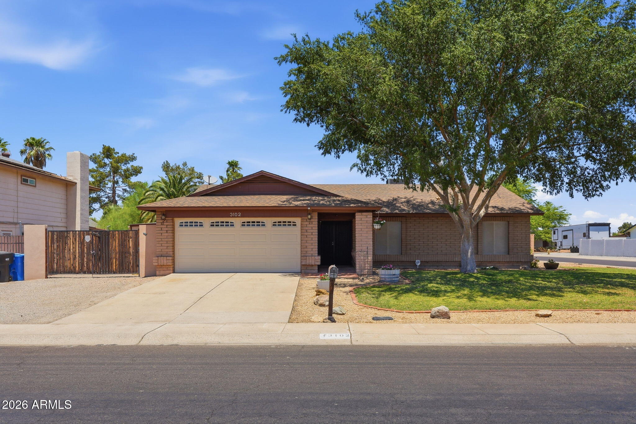 Move-in ready 3-bedroom, 2-bath home on a large corner lot with no HOA! The home features fresh interior paint, brand-new carpet in the bedrooms, an A/C replaced in 2020, and desirable north/south exposure.

The spacious primary bedroom features a walk-in closet, dual sinks, and a tiled shower. Updated windows, an RV gate off the driveway with a dedicated 50-amp RV outlet, and a second RV gate with side-street access add to the home's versatility.

French doors lead to the backyard, offering a great space for outdoor entertaining.