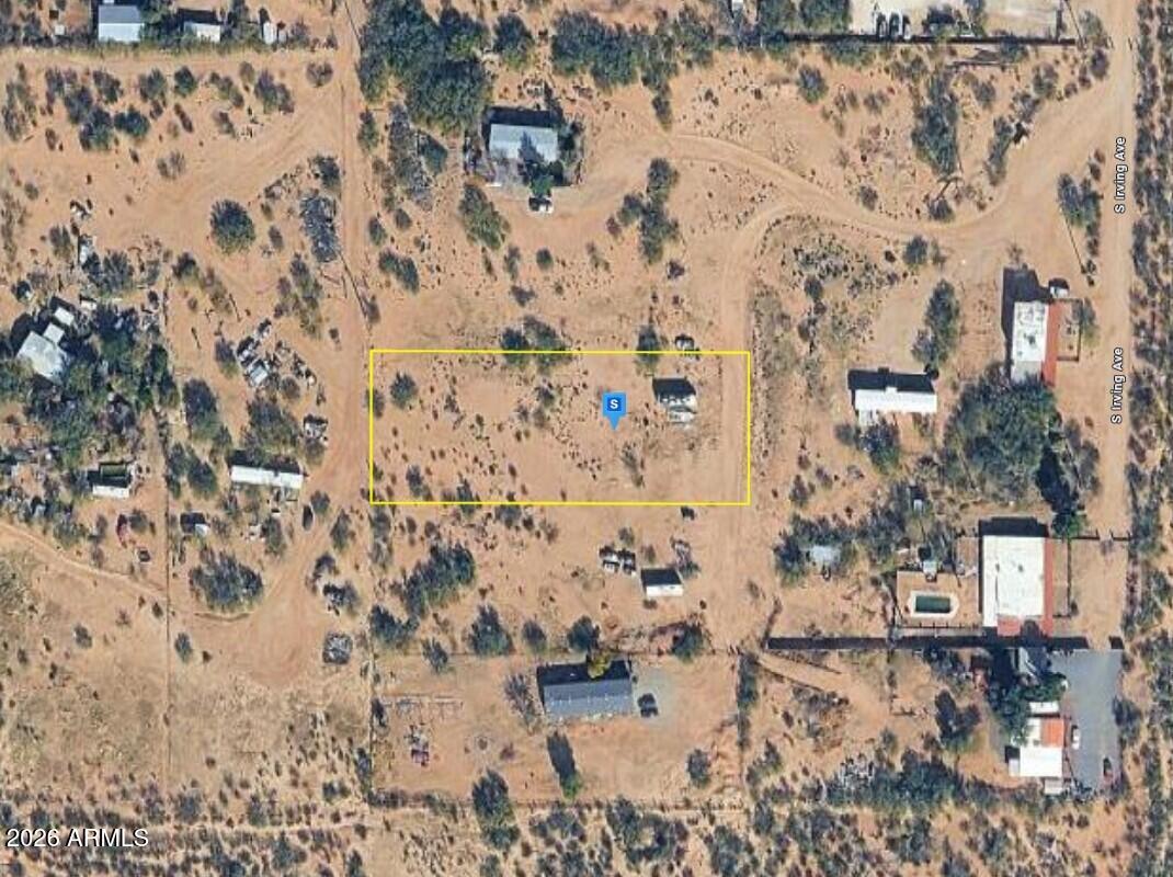 This vacant lot offers an excellent opportunity to build your future home or make a smart investment. Situated in Sahuarita, the property features 1 acre of open terrain. A septic system is required, and the property has access to a shared well (per seller). Enjoy a peaceful setting while remaining conveniently located near shopping, dining, schools, and major highways, providing easy access to nearby amenities and surrounding areas. Whether you're looking for a private retreat, a development opportunity, or a long-term investment, this lot provides the flexibility and location to suit your needs.