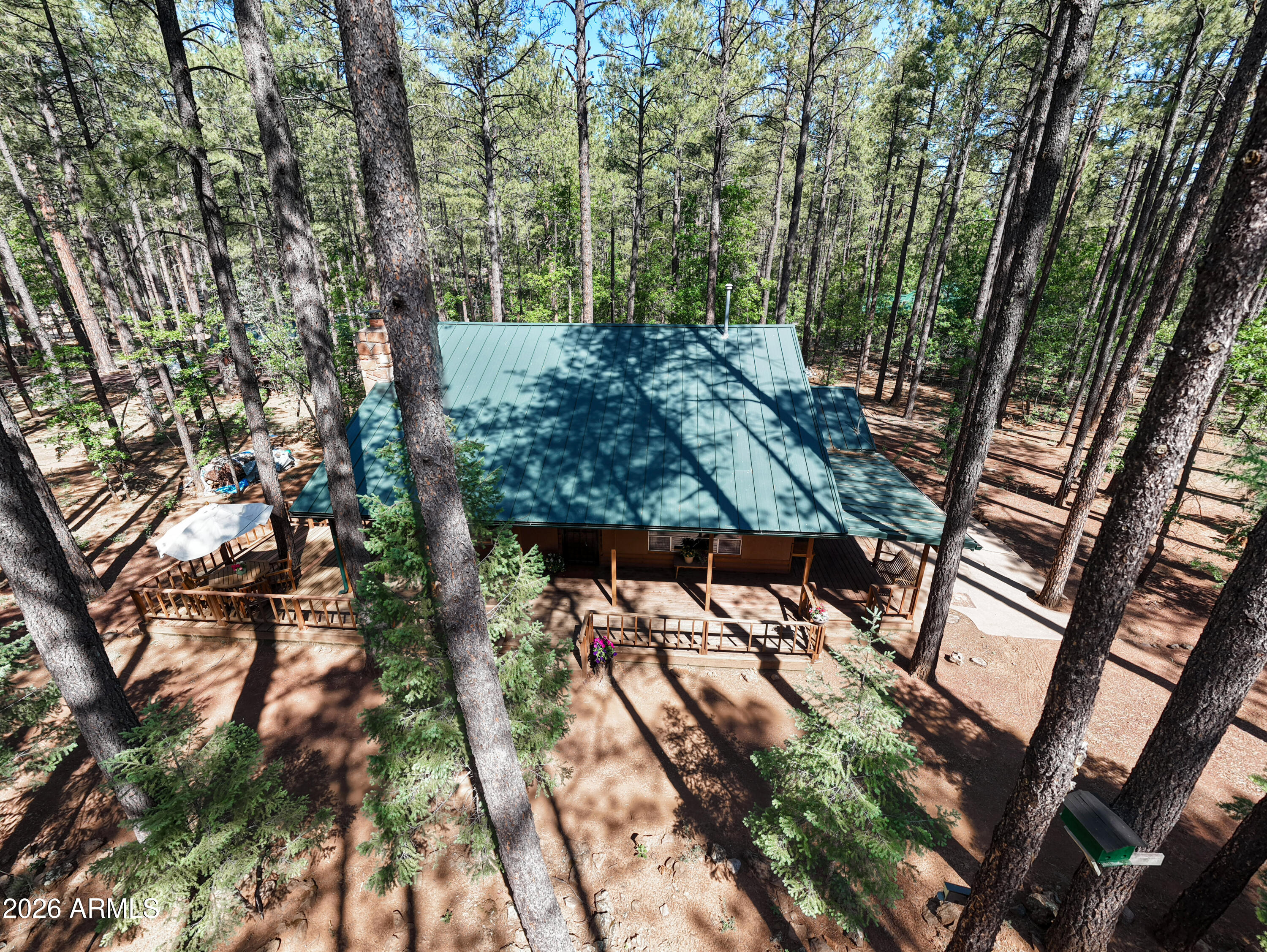 White Mountain Summer Homes! 3 Bedroom, 2 Bath, 1805 Square Feet on .78 Acres. Metal roof. Remodeled kitchen and bathrooms with tile flooring, granite countertops, custom cabinets, appliances. Master downstairs. Upstairs loft is large w/ closet and beautiful wood flooring. Both bedrooms upstairs have high ceilings. The laundry room has stainless utility sink, ample storage with custom pull outs for storage. Wrap around deck. A really nice floorplan. Fireplace in living room. Great location!