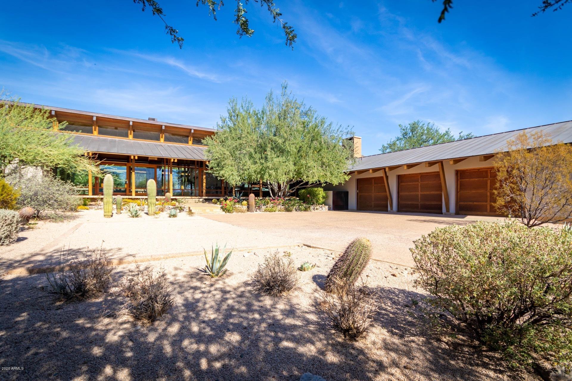 Tucked at the base of the mountain range in coveted exclusive North Scottsdale's manned guard gate DC Ranch lies this architecturally significant stunning contemporary. High bones, mixed media finishes, soaring windows, chefs Wolf and Miele appliances, 4 fireplaces, Poggenpohl custom cabinets imported from Europe throughout, surround sound and AIA award winning house. Split floorplan, separate den office, saturated with natural light and windows capturing every view. Highest end finishes throughout the home, architecturally significant, you couldn't build such a home for under 5 million. Steps from golf course and biking distance to Market Street shops and DC Ranch Country Club. Beautiful walking paths just outside the door, a scenic modern oasis. Beautiful real wood floors just refinished