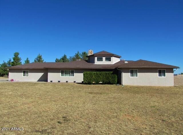 This gorgeous 4BR/2BA/2CG, 2243 sq.ft., home on 1.6 acres in Sierra Vista, AZ is minutes from Ft. Huachuca, shopping & schools.  The home has been upgraded with wood plank tile floors in the living areas, kitchen / dining areas, hallways and bathrooms.  There are granite counters in the kitchen & bathrooms, a large walk-in pantry, ceiling fans throughout the home & custom molding and baseboards. There are 2 central HVAC units to keep the home cool in the summer and warm in the winter.  There is also a custom wood burning fireplace to keep you cozy.  The back yard has a large grass lawn, lots of custom concrete patios/sidewalks and pavers to include a firepit and benches.  Raised garden beds & fruit trees, a play set and trampoline are all included with the mountain views. Call today!