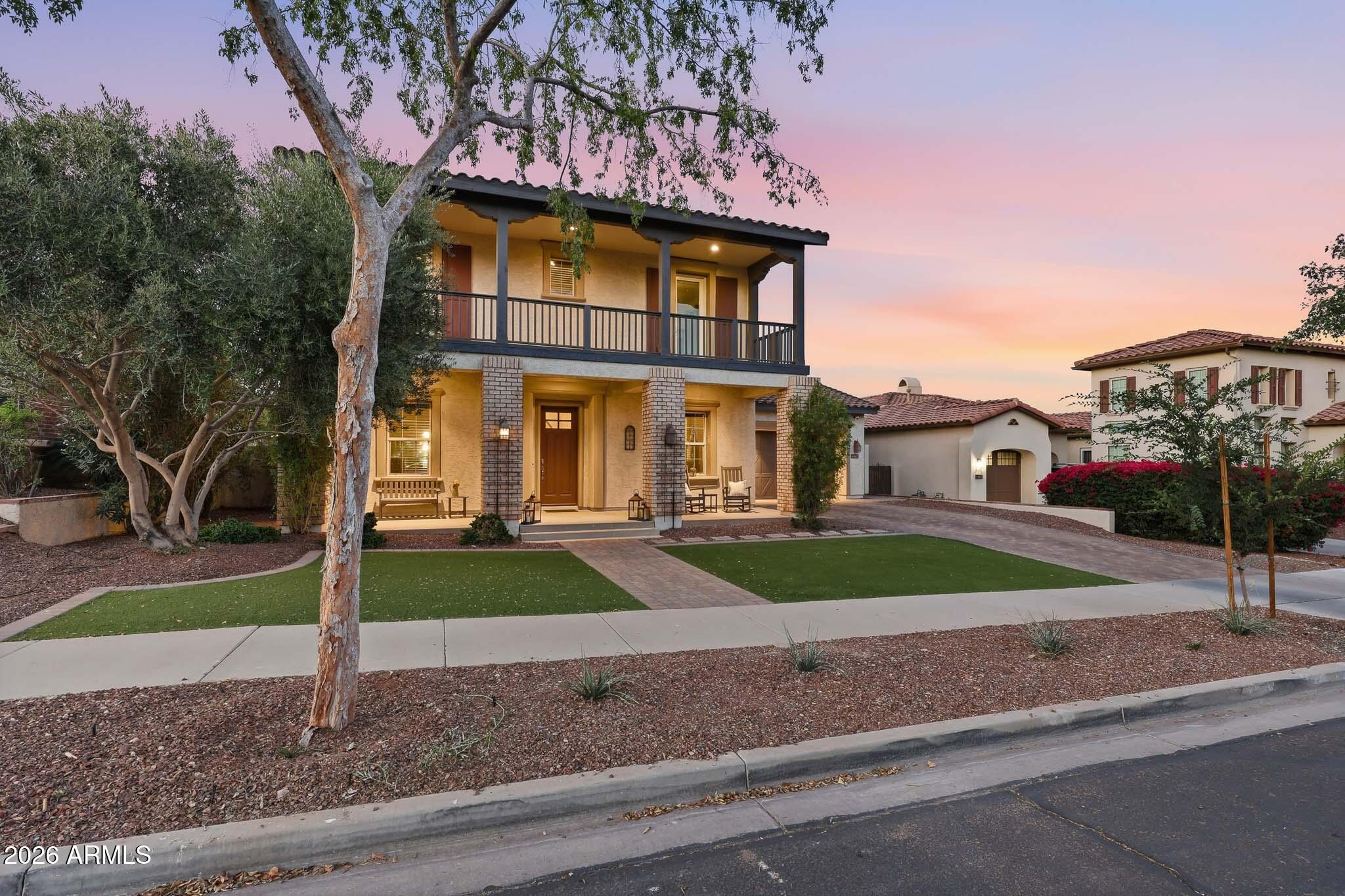Tucked into the heart of Verrado's coveted Main Street District, this stunning 4,052 SF home puts you just steps away from shops, locally-loved restaurants, top-rated schools, and the community fitness center--everything you need, right outside your door. With 5 spacious bedrooms, a versatile den, and 3.5 bathrooms, this home offers room for everyone to gather. The heart of the home is an inviting living room anchored by a cozy gas fireplace. Updated in 2021, the kitchen features quartz countertops, new stainless steel appliances, and a butler's pantry. Downstairs you have a large bedroom with a walk-in closet. Upstairs, the home offers a loft and a thoughtful layout featuring private balconies off of the primary and two other bedrooms. Step outside into a resort style backyard. The sparkling pool was just resurfaced in 2026, and has a brand-new Pentair filter. Surrounded by lush landscaping and designed with privacy in mind, this backyard oasis is made for gatherings. Freshly painted exterior in 2025. Garage has attached cabinets and is epoxied. Living in Verrado's Main Street District means embracing a vibrant, walkable community where coffee shops, farmers markets, seasonal festivals, parks, and trails are part of everyday life. Don't miss your chance to own one of Verrado's most desirable properties.