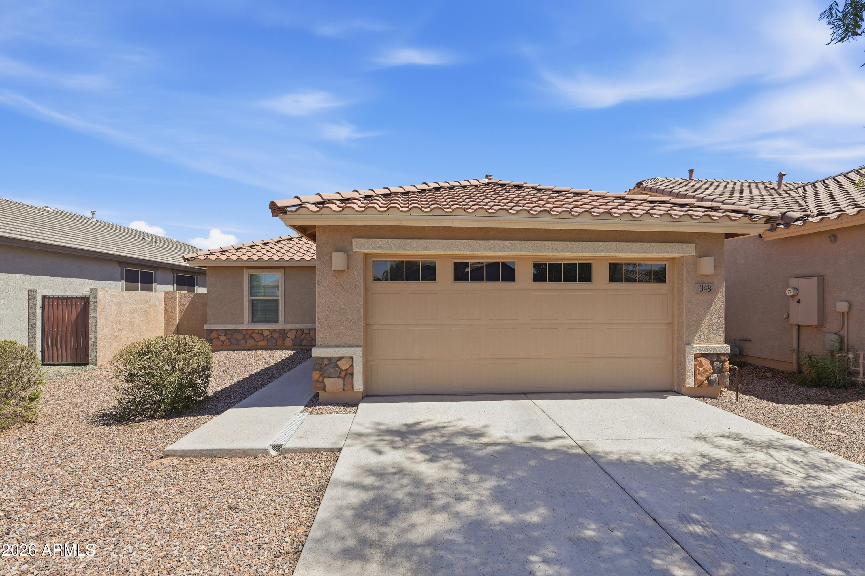 The Bisbee is a beautiful single-story home offering approximately 1,400 square feet of living space including three bedrooms, two bathrooms and a two-bay garage.  The foyer effortlessly opens to an open living area encompassing the Great Room, kitchen and nook, plus enjoy a covered patio off the Great Room for entertaining outdoors. The primary suite is spacious and boasts a luxurious bath with a large walk-in closet. There is upgraded wood plank tile flooring throughout the home, except the bedrooms and granite kitchen counter tops with stainless steel appliances.