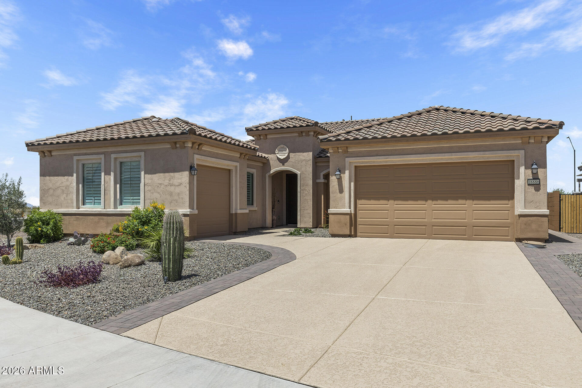 STUNNING, NEW Desert-Back Home with No Direct Neighbors! Never lived in & beautifully upgraded in 2025, this fully landscaped cul-de-sac home features high ceilings, large tile flooring throughout the main living areas & a stackable wall-to-wall slider for seamless indoor/outdoor living. The LUX kitchen is a true centerpiece with white cabinetry, quartz countertops, oversized island with breakfast bar, gas cooktop, double ovens, walk-in pantry & plenty of storage. The open living area features premium electric blinds, while louvered shutters are featured throughout the bedrooms. The primary suite offers backyard access, walk-in closet, a spacious ensuite with dual vanities & modern tiled walk-in shower with double shower heads. Two additional bedrooms, one with a walk-in closet, share a dual-entry bath, while a separate sizable den & half bath add flexible living spaces. Both front & back yards are fully landscaped & pavered. The backyard offers a large, covered patio backing to open desert for added privacy. Additional highlights include Smart-home technology, all 3 garage stalls with high-quality epoxy flooring, brand-new appliances & furniture that can convey with the home! Located in Sun City Festival with access to golf, resort-style pools & spa, fitness center, pickleball, tennis, walking trails, community clubs, dining & more, all with convenient access to Loop 303 & nearby shopping and recreation!