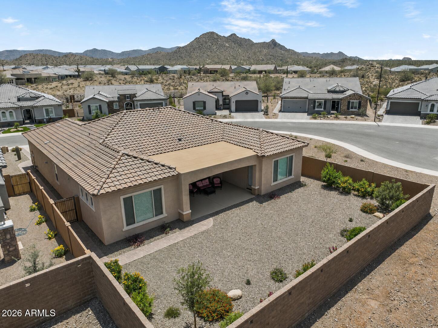 FANTASTIC  Desert-Back Home (3 Bed/ 2 Bath PLUS Den & 3-Car Garage) with No Direct Neighbors! Never lived in & beautifully upgraded in 2025, this FULLY LANDSCAPED & PAVERED cul-de-sac home features high ceilings, elegant large tile flooring throughout the main living areas & a stackable wall-to-wall slider for seamless indoor/outdoor living. The LUX kitchen is a true centerpiece with, toffee granite countertops, oversized island with breakfast bar, gas cooktop, double ovens & walk-in pantry. The open living area features premium electric blinds, while louvered shutters are featured throughout the bedrooms. The primary suite offers backyard access, walk-in closet, a spacious ensuite with dual vanities & modern tiled low-threshold shower with double shower heads. *Buyer financing incentive available* Located in Sun City Festival with access to golf, resort-style pools & spa, fitness center, pickleball, tennis, walking trails, community clubs, dining & more, all with convenient access to Loop 303 & nearby shopping and recreation!