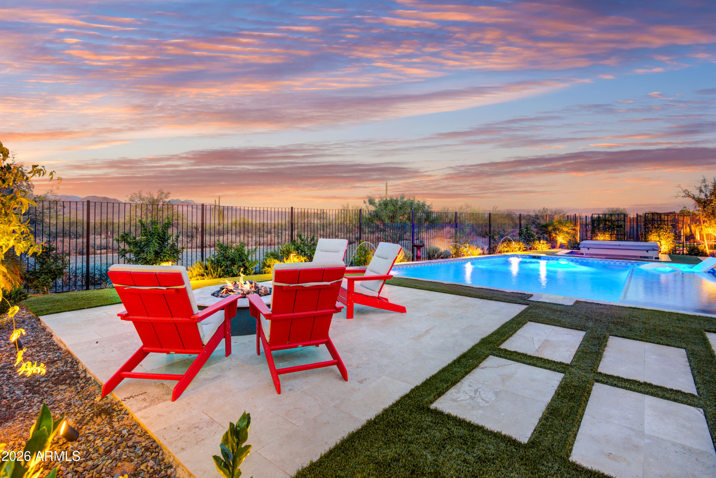 Rarely does an opportunity come available such as this: Highly upgraded Latigo plan with a Guest Casita and a JAW DROPPING UNOBSTRUCTED VIEWS OF TONTO NATIONAL FOREST! Spectacular beyond all expectations this stunning home is perfectly located in the prestigious Trilogy at Verde River on one of the most coveted homesites in the community backing directly to Tonto National Forest with majestic views that will take your breath away! As you step through the front courtyard, you are greeted by a stunning water feature, setting the tone for the elegance that awaits. Beautifully designed with luxurious upgrades: chic hardwood-style tile floors, oversized waterfall edge kitchen island; GE Monogram appliances, decorative tile backsplash, and a lot more. Master suite is generously sized and offers his and hers walk-in closet, double sinks and a walk-in shower. A Guest Casita provides an additional private space for visitors or can be used as a home office or exercise room. The smart space includes a custom built in pantry, and granite countertops, catering to both convenience and style. Practicality meets luxury with an extended garage featuring epoxy floors and offering ample storage. Great Room opens to the extended patio for outdoor entertaining. The outdoor spaces are equally enchanting. The covered patio is an idyllic retreat, featuring ceiling fan, and a linear fireplace, allowing you to enjoy the outdoors all year round. The outdoor covered patio offers the perfect setting for al fresco dining and entertaining. The centerpiece of this remarkable property is a stunning saltwater pool, providing a refreshing oasis with breathtaking views of the surrounding mountains. It is an ideal spot to relax, unwind, and soak up the natural beauty that surrounds you. 
All this and more set in one of the valley's most scenic locations in the world class Trilogy community. 
This exquisite home provides Resort Lifestyle at it's finest! 
Trilogy at Verde River offers upscale Resort living at its finest and the very best of all possible worlds, close to the conveniences of affluent North Scottsdale, yet secreted within the pristine privacy of the Sonoran Desert. 
The amenities are World Class with Tom Lehman inspired eighteen-hole Golf course, tennis courts, pickle ball courts, and bocce ball, heated lap pool and Resort style swimming pool, hot tub, Afterburn fitness center, Helen's demonstration Kitchen for cooking classes and a 7.5 acre dog park. The community center has casual poolside dining at Eddy's Diner and gourmet dining at award-winning Needle Rock Kitchen and Tap, Alvea Spa with full-service Salon and Spa amenities, Art Loft and events center. Trilogy at Verde River is adjacent to the Tonto National Forest and is situated in the middle of miles and miles of hiking and biking trails. 
Whether you're seeking a second, winter home, or will live here year-round, Trilogy at Verde River is an ideal distance from the hustle and bustle of North Scottsdale. Attitudes here are different; there's a sense of community. You'll love the Resort living!
What memories will you make?