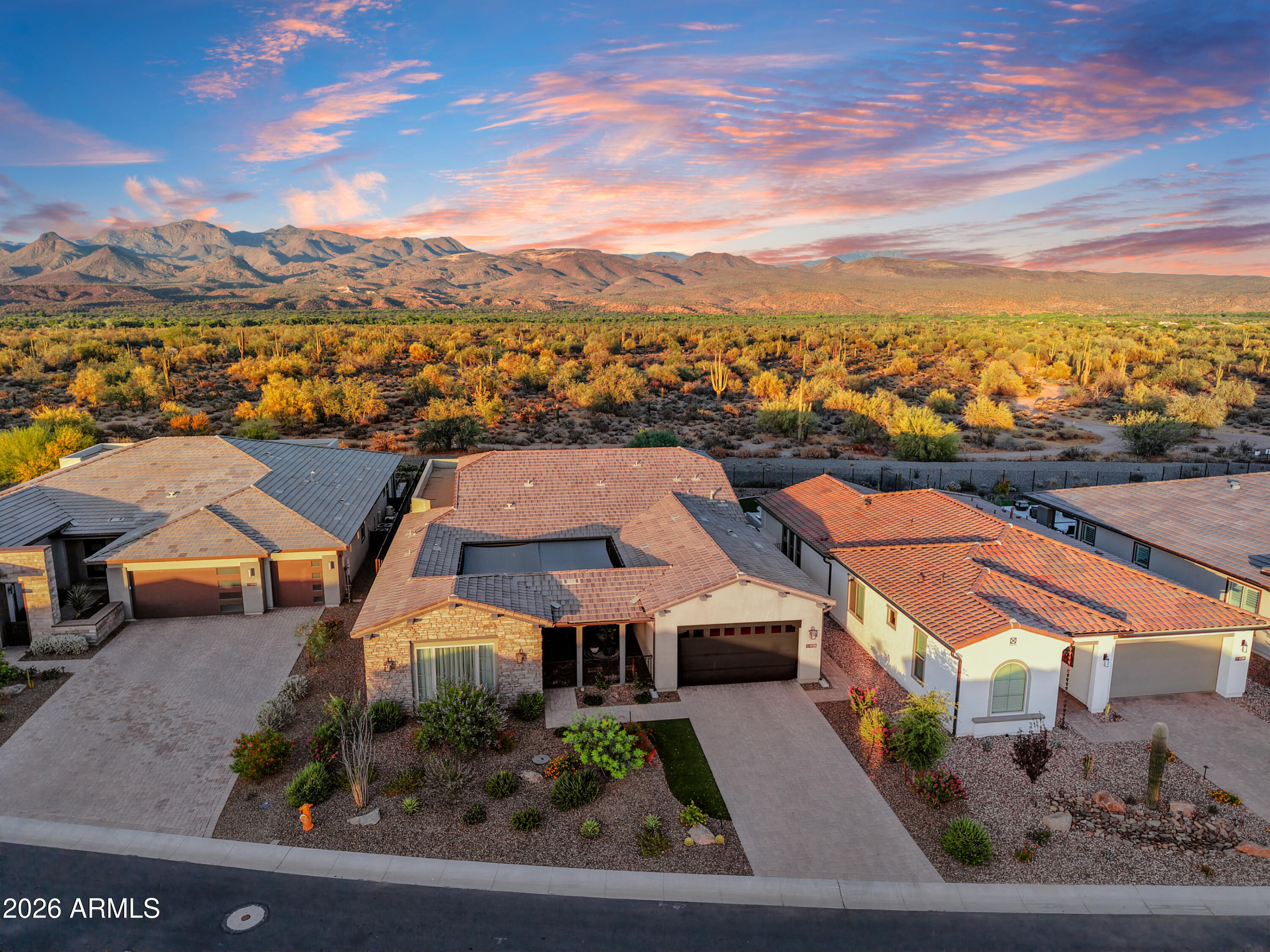 Rarely does an opportunity come available such as this: Highly upgraded Latigo plan with a Guest Casita and a JAW DROPPING UNOBSTRUCTED VIEWS OF TONTO NATIONAL FOREST! Spectacular beyond all expectations this stunning home is perfectly located in the prestigious Trilogy at Verde River on one of the most coveted homesites in the community backing directly to Tonto National Forest with majestic views that will take your breath away! As you step through the front courtyard, you are greeted by a stunning water feature, setting the tone for the elegance that awaits. Beautifully designed with luxurious upgrades: chic hardwood-style tile floors, oversized waterfall edge kitchen island; GE Monogram appliances, decorative tile backsplash, and a lot more. Master suite is generously sized and offers his and hers walk-in closet, double sinks and a walk-in shower. A Guest Casita provides an additional private space for visitors or can be used as a home office or exercise room. The smart space includes a custom built in pantry, and granite countertops, catering to both convenience and style. Practicality meets luxury with an extended garage featuring epoxy floors and offering ample storage. Great Room opens to the extended patio for outdoor entertaining. The outdoor spaces are equally enchanting. The covered patio is an idyllic retreat, featuring ceiling fan, and a linear fireplace, allowing you to enjoy the outdoors all year round. The outdoor covered patio offers the perfect setting for al fresco dining and entertaining. The centerpiece of this remarkable property is a stunning saltwater pool, providing a refreshing oasis with breathtaking views of the surrounding mountains. It is an ideal spot to relax, unwind, and soak up the natural beauty that surrounds you. 
All this and more set in one of the valley's most scenic locations in the world class Trilogy community. 
This exquisite home provides Resort Lifestyle at it's finest! 
Trilogy at Verde River offers upscale Resort living at its finest and the very best of all possible worlds, close to the conveniences of affluent North Scottsdale, yet secreted within the pristine privacy of the Sonoran Desert. 
The amenities are World Class with Tom Lehman inspired eighteen-hole Golf course, tennis courts, pickle ball courts, and bocce ball, heated lap pool and Resort style swimming pool, hot tub, Afterburn fitness center, Helen's demonstration Kitchen for cooking classes and a 7.5 acre dog park. The community center has casual poolside dining at Eddy's Diner and gourmet dining at award-winning Needle Rock Kitchen and Tap, Alvea Spa with full-service Salon and Spa amenities, Art Loft and events center. Trilogy at Verde River is adjacent to the Tonto National Forest and is situated in the middle of miles and miles of hiking and biking trails. 
Whether you're seeking a second, winter home, or will live here year-round, Trilogy at Verde River is an ideal distance from the hustle and bustle of North Scottsdale. Attitudes here are different; there's a sense of community. You'll love the Resort living!
What memories will you make?
