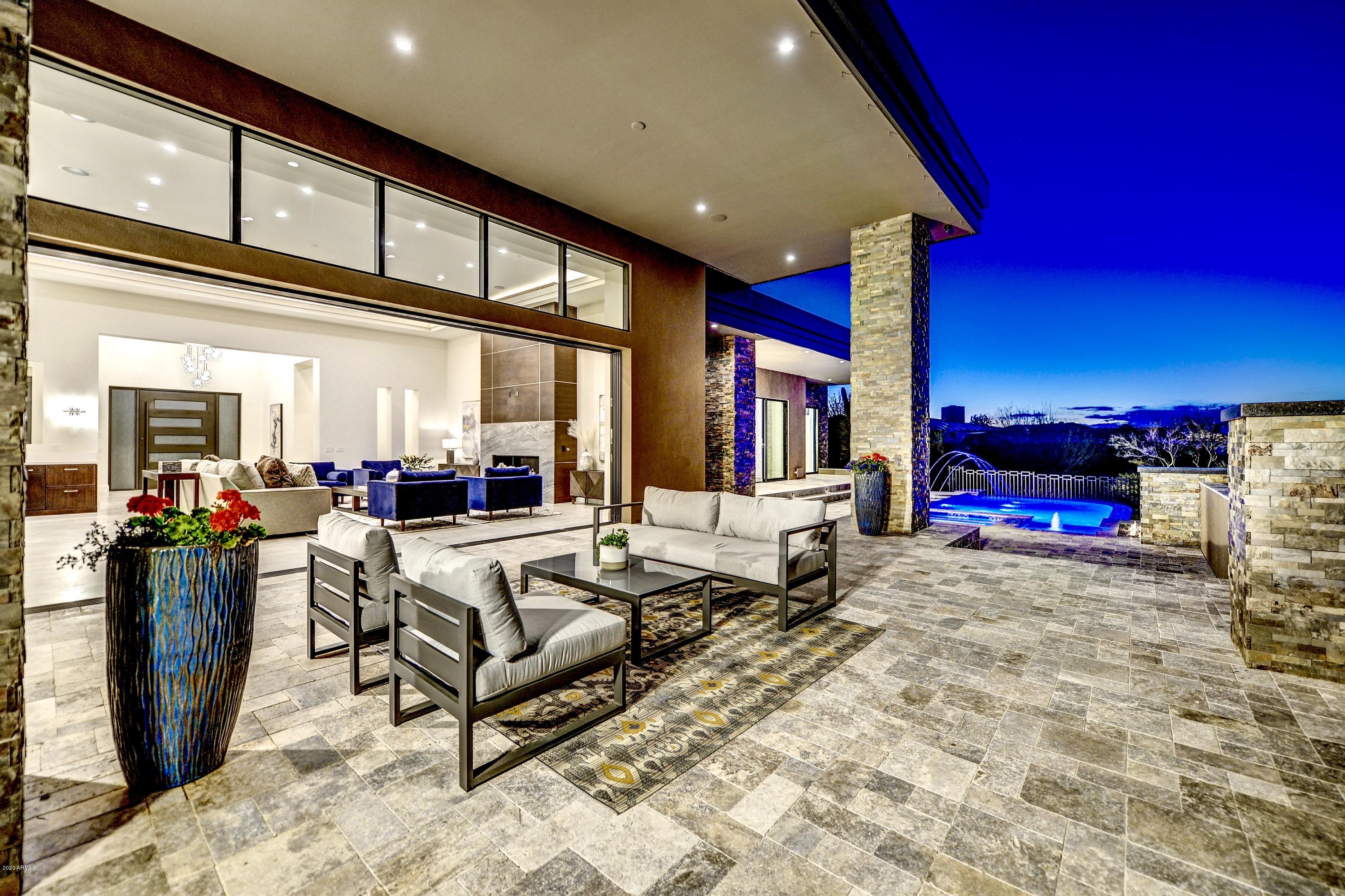 Estancia New Build completed Jan 2020 now move in ready. 6200sf single level contemporary located on a N/S golf course lot showcasing an open floor plan, soaring ceilings, fireplace, and sliding glass walls. An adjacent wet bar, and formal dinning room completes a discerning entertaining space. Generous sophisticated kitchen with Wolf/Subzero appliances, marble and quartz countertops, and hand crafted walnut cabinetry. At the end of the day escape to your master suite retreat including spa like master bath, exercise/flex space, and fireplace while enjoying the pool/spa/mountain views and tranquility. Private outdoor living spaces to include heated pool/spa, outdoor kitchen, fire features and open views.