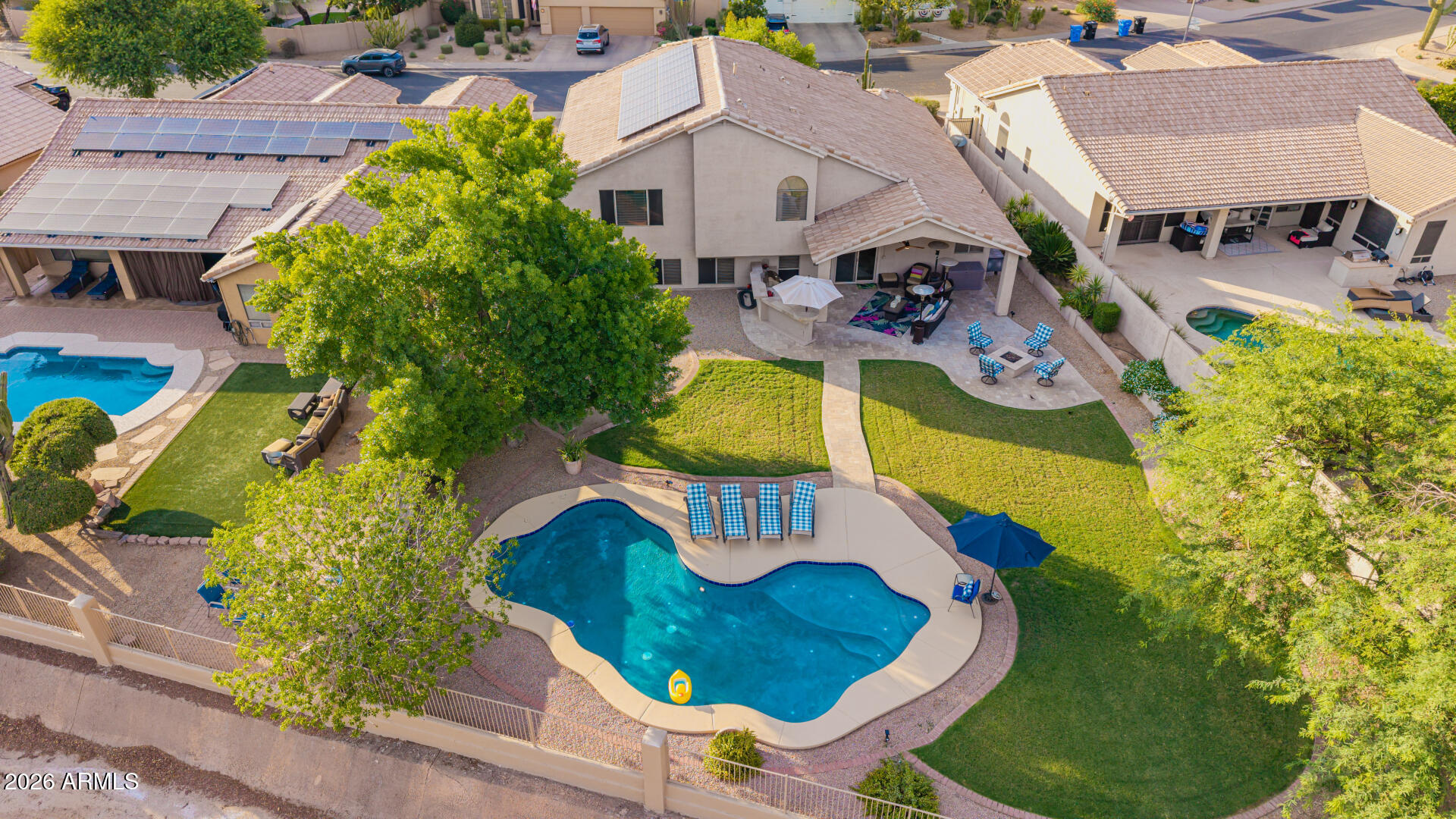 Welcome to this stunning Cave Creek home, where modern style and timeless character come together on an oversized lot with a view fence and expansive open-space views. This exceptional tri-level residence offers 5 bedrooms, 3 bathrooms, and the perfect combination of space, privacy, energy efficiency, and resort-style outdoor living.

From the moment you enter, you'll be impressed by the expansive living and dining rooms, soaring vaulted ceilings, designer light fixtures, and an abundance of natural light that fills the home. Neutral paint tones and a tasteful blend of tile and carpet flooring create a warm, inviting atmosphere that complements any décor style. The thoughtfully designed floor plan offers generous living spaces and oversized bedrooms, providing comfort and flexibility for families, guests, or a home office setup.
The separate family room is ideal for entertaining and everyday living, featuring a wet bar that makes hosting friends and family effortless. At the heart of the home is the beautifully appointed kitchen, complete with abundant cabinetry, granite countertops, stainless steel appliances, a mosaic tile backsplash, built-in desk area, center island with breakfast bar, and plenty of workspace for cooking and gathering.
Retreat to the spacious primary suite through elegant double doors and enjoy a private sanctuary featuring dual vanities, a soaking tub, separate shower, and a large walk-in closet. Additional bedrooms are generously sized, offering plenty of room for family and guests alike.
Step outside and discover your own private backyard oasis. The sparkling pool invites you to relax and cool off during Arizona summers, while the built-in BBQ area creates the perfect setting for outdoor dining and entertaining. The expansive lot, open views, and view fencing provide a rare sense of privacy and tranquility, allowing you to enjoy breathtaking sunsets and desert skies with no homes directly behind you.
Enhancing both value and efficiency, this home includes owned solar panels that help lower monthly utility costs and deliver long-term savings. A brand-new roof installed in 2026, backed by a transferable warranty, offers added confidence and peace of mind for the next owner.
Located in one of Cave Creek's most desirable communities, this home offers the space, privacy, and amenities today's buyers are looking for. Whether you're hosting friends, enjoying family time, or simply unwinding by the pool, this property is designed for comfortable Arizona living at its finest.
