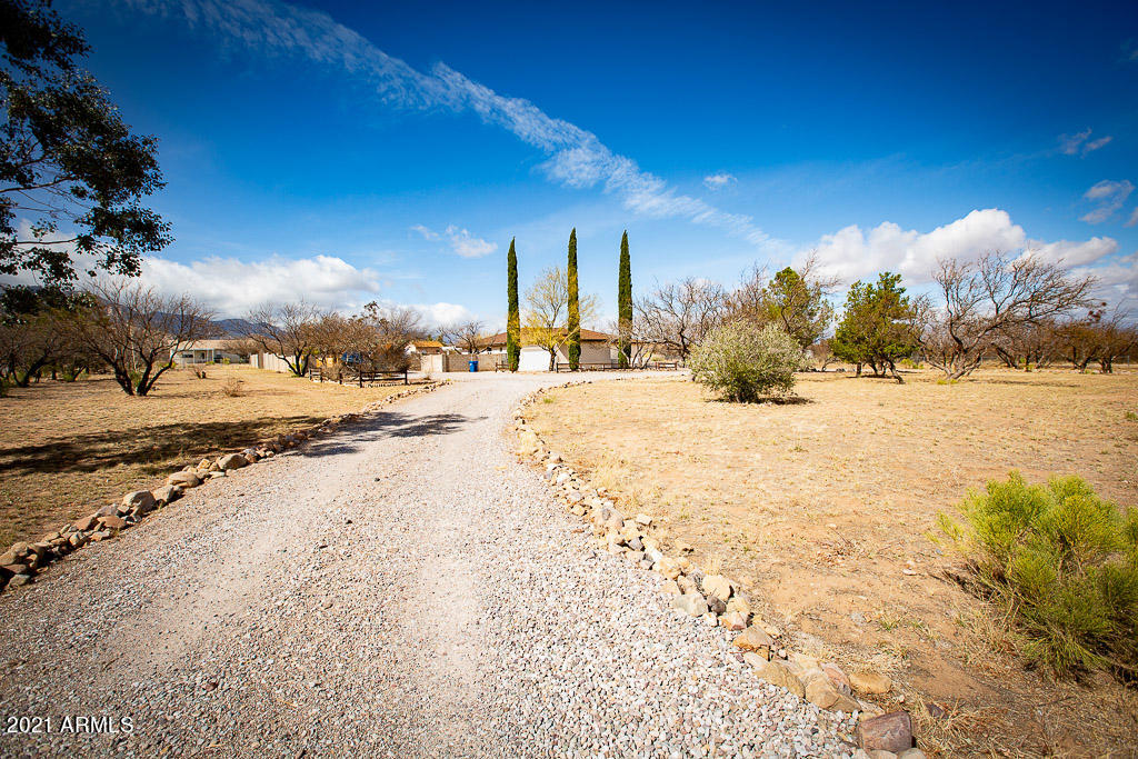 Gorgeous home sitting over 2 acres! Upgrades exceed your imagination ... take a walk through what you only see in magazines. 4 spacious bedrooms and 3 bathrooms make this house perfect for any size family. Off the garage is extra large mud room/laundry room. 2 living rooms, formal dining room and a back porch to extend your living space into the open Arizona sky. Stunning finishes in your new kitchen will make you want to cook everyday. 
You will not be disappointed .. schedule your private viewing today before someone else scoops it up.