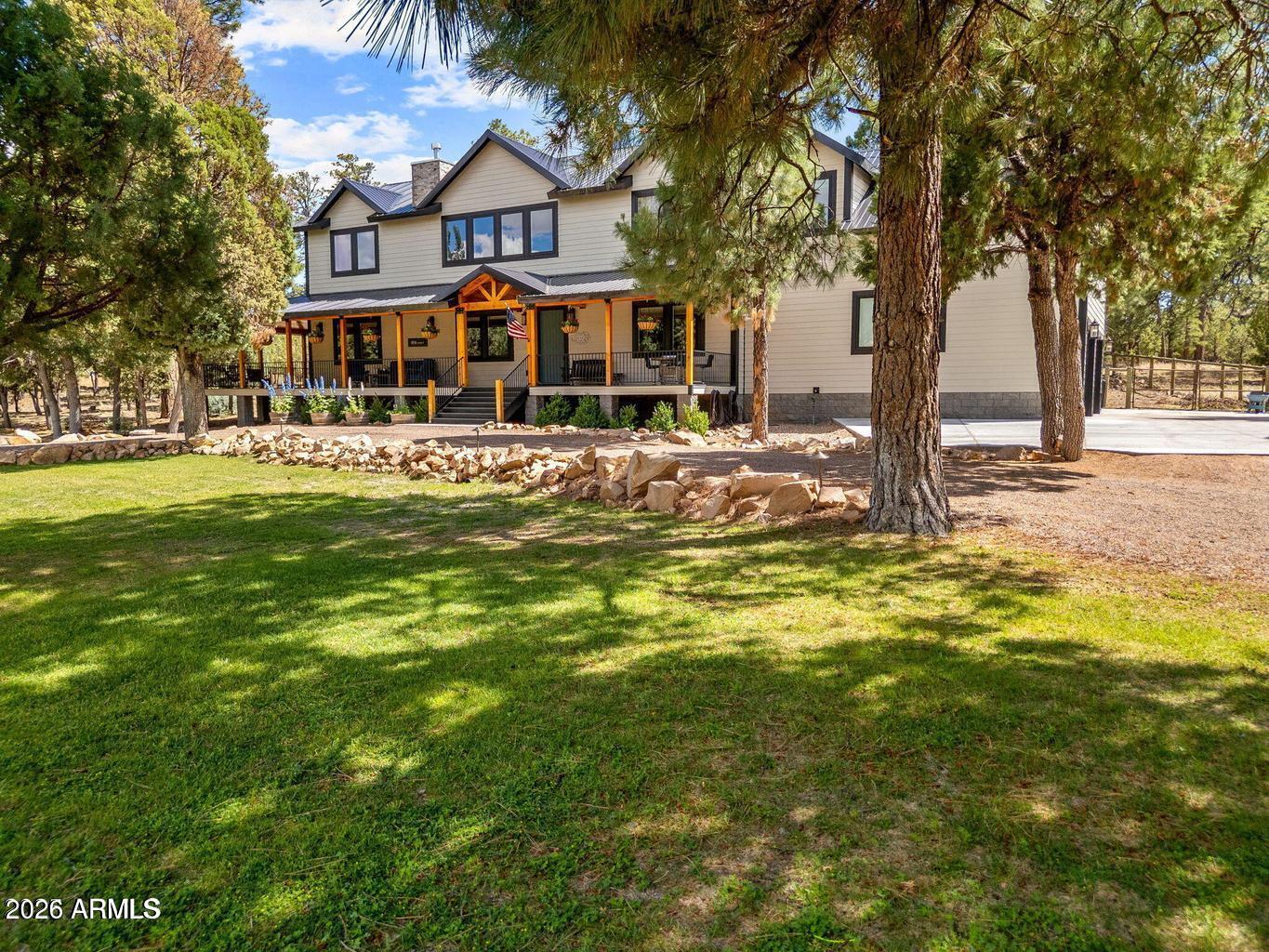 Welcome to this stunning 7-bedroom, 4-bathroom home, built in 2019 and offering 4,085 square feet of luxurious living space. With high-end finishes throughout, this home is perfect for family living and entertaining. The gourmet kitchen features sleek granite countertops, high-end stainless steel appliances--including an oversized refrigerator--and a large island that's ideal for meal preparation and gatherings. The family room boasts soaring ceilings, creating an open and inviting atmosphere. Upstairs, you'll find a spacious loft area that's perfect for a home office, playroom, or additional living space. The oversized 2-car garage offers plenty of room for vehicles & extra storage with an electric car charger that conveys. Beautifully fenced-in backyard with a massive wrap-around porch. Perfect for family gatherings or simply relaxing in the fresh air. This home is on city water and sewer, eliminating the need for a septic system. With its modern design and ample space, this home offers the perfect blend of comfort, style, and functionality.