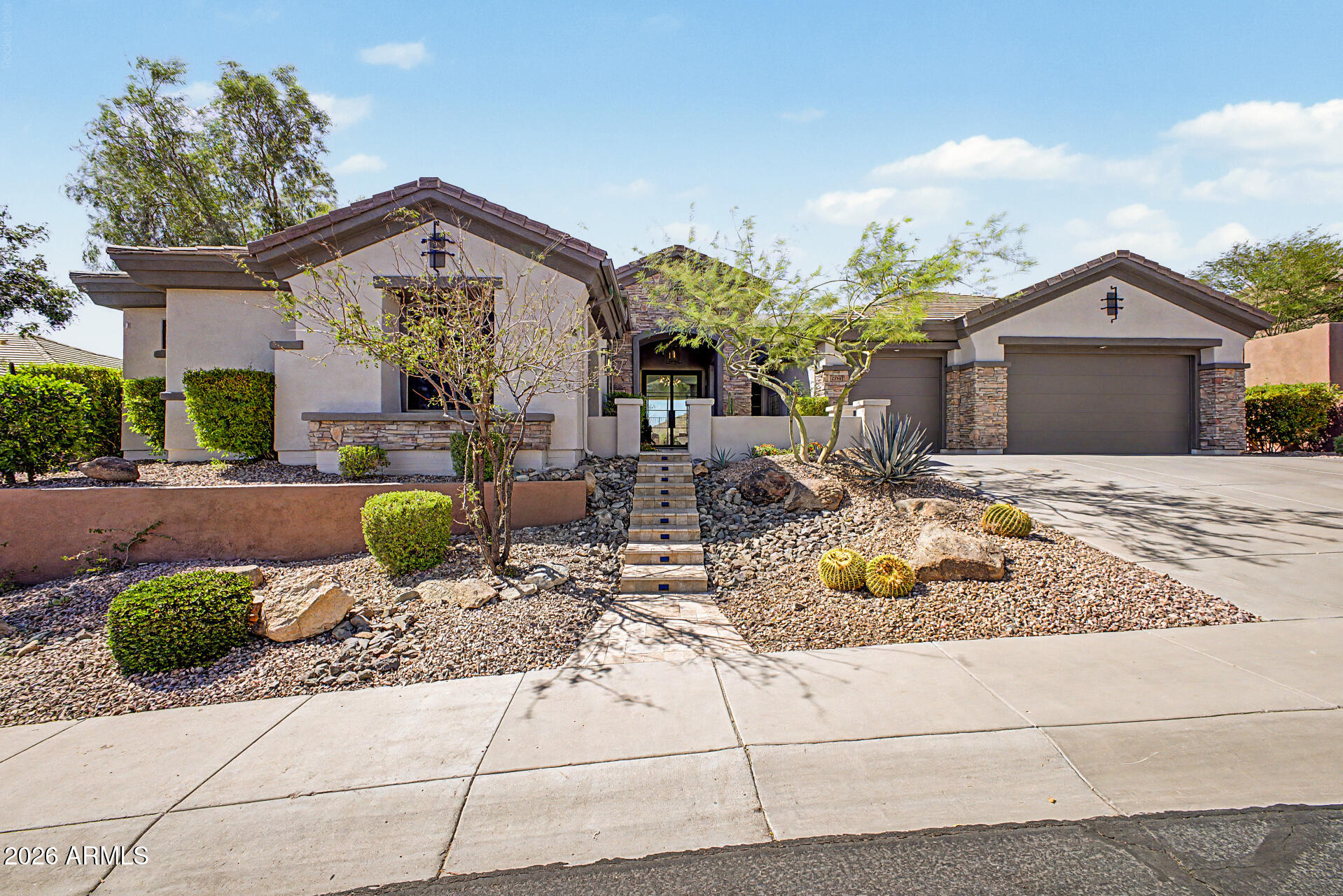 A rare opportunity to own what may be the most extensively reimagined residence in Anthem Country Club.

Perched on one of the community's most extraordinary homesites, 2554 W. Shinnecock Way commands breathtaking 180-degree panoramic views stretching across Daisy Mountain, pristine State Land Trust Preserve, and the endless beauty of the Sonoran Desert. With ideal north/south exposure, complete privacy, and forever-protected vistas, the setting is nothing short of spectacular.

Taken down to the studs and completely transformed, this residence has been masterfully redesigned into a showcase of modern luxury and architectural sophistication. Every finish, fixture, and detail was thoughtfully selected to create a home that feels more akin to a custom Scottsdale estate than anything prev seen in Anthem Country Club.

The heart of the home is a stunning chef's kitchen featuring custom cabinetry, dramatic quartz surfaces, designer lighting, premium appliances, and an expansive waterfall island that seamlessly anchors the open-concept living spaces. Walls of glass frame the surrounding mountains and preserve, creating an ever-changing backdrop of desert beauty and unforgettable Arizona sunsets.

The luxurious primary retreat offers a true spa experience, highlighted by a freestanding soaking tub, oversized walk-in shower, custom dual vanities, designer tilework, and serene mountain views that transform daily routines into moments of relaxation.

Every room has been curated with a refined, contemporary aesthetic that balances warmth, elegance, and functionality. Wide-plank flooring, custom millwork, sophisticated textures, and exceptional craftsmanship elevate the home throughout.

Outside, the experience becomes truly extraordinary. The elevated homesite captures some of the most remarkable views in all of Anthem Country Club, offering complete privacy and unobstructed sightlines across protected desert landscapes. Whether entertaining guests, enjoying morning coffee, or watching the sun disappear behind the mountains, this is Arizona living at its finest.

Located within the award-winning Anthem Country Club, residents enjoy two championship golf courses, resort-style pools, fitness centers, tennis and pickleball courts, exceptional dining, and a vibrant social lifestyle, all within the security of a guard-gated community.

Homes can be remodeled. Views cannot be replicated. Combined with one of the finest homesites in Anthem Country Club, this extraordinary transformation creates a truly irreplaceable luxury residence.