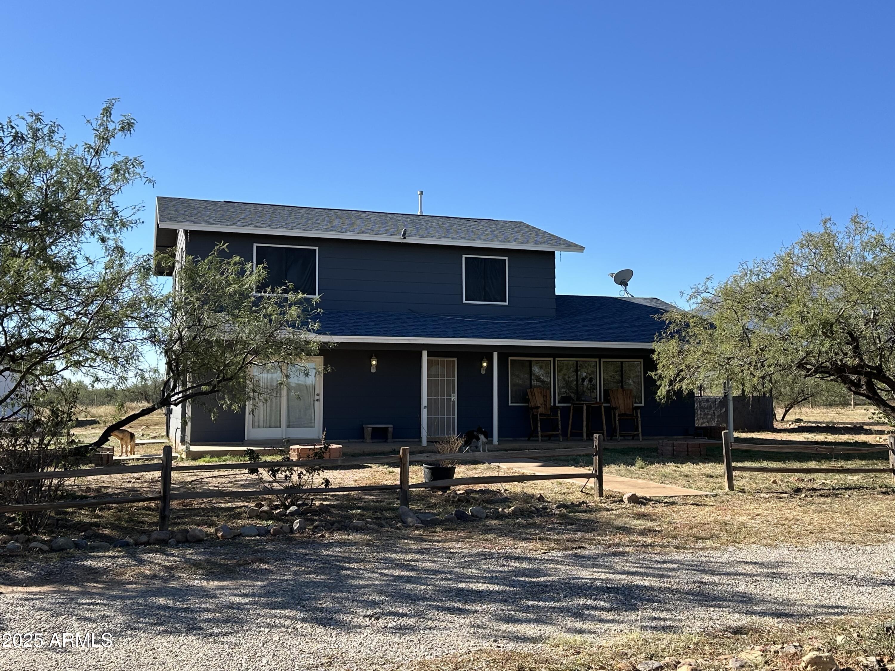 This property is ready for you and your horses! Your horses will love the 10 stall barn with tack room! The people will love the beautiful 4 bedroom 2 bath home that has been lovingly updated. There is no carpet making it very easy care. The kitchen features a stainless gas range with built in microwave, lovely stainless refrigerator and dishwasher and updated maple cabinetry. You will love the custom shutters throughout the house! The bedrooms are upstairs and the master suite is a piece of heaven. Custom paint, HUGE walk in closet and a beautiful bath that  include a custom walk in shower. The secondary bedrooms are all good sized and one has a walk in closet. The main bath has also been upgraded and includes a ball and claw tub. Step outside and you will love the 20x40 shop with two exterior covered parking areas for your tractor, mower or? Inside the shop there is ample room for all of your projects. The property is also completely fenced and cross fenced. The property includes 2 parcels. The 2nd parcel has a separate well share that is stubbed just inside the property line. It also has power at the property line as well. It sits to the south of the main house parcel. That parcel number is 104-82-022P. An additional property to the North that also includes a horse boarding facility is also available for sale for 199000.