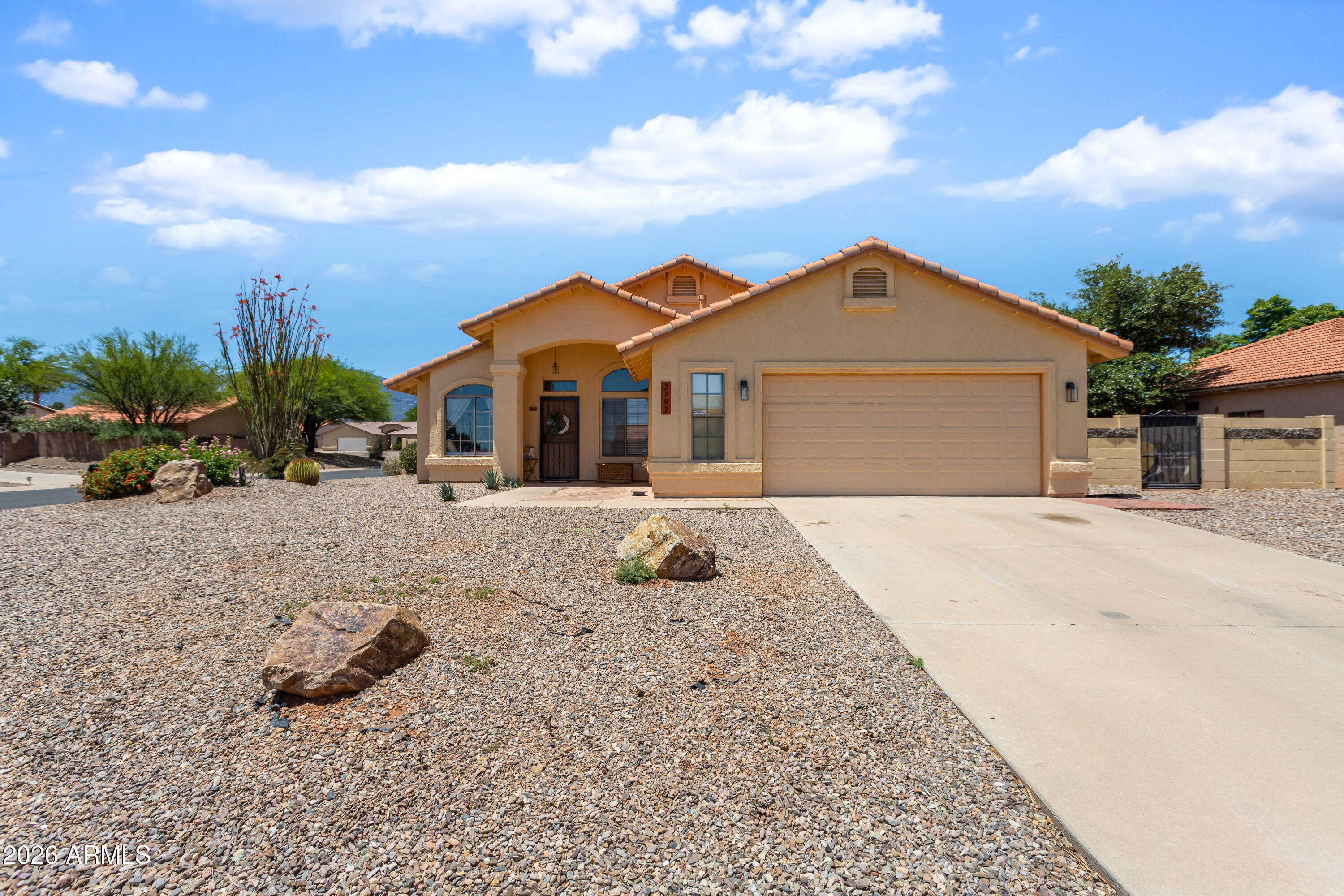 Fantastic remodeled home on a corner lot in Canyon De Flores. This home boasts of pride in homeownership. This home has new stainless steel applianes, New carpet in the bedrooms, and a classy paint palet throughout.  Two living rooms, and an eat in kitchen as well as a formal dining area.  In the family room the home has a gas fireplace for the cozy cooler nights.  The seller has installed artificial turf in the backyard and a firepit for all your entertaining needs.This is a must see home.