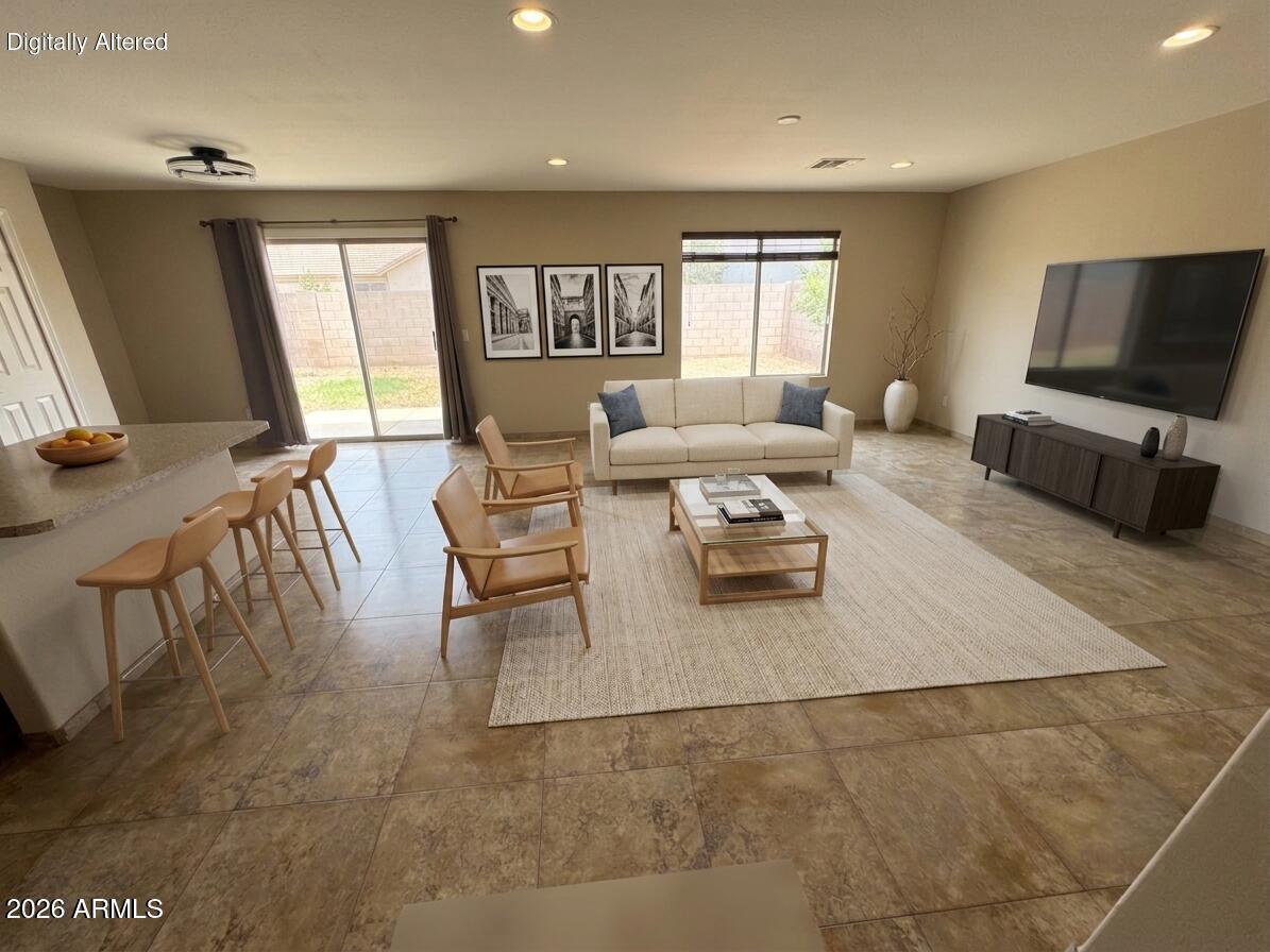 Seller concessions offered making this move-in-ready home in The Village at SanTan Heights an exceptional opportunity! Featuring fresh interior paint, a bright open-concept layout, and modern upgrades throughout, this home offers the perfect blend of comfort and style. The spacious kitchen showcases stainless steel appliances, a large center island, and seamless flow into the great room--ideal for entertaining. A rare main-level bedroom and full bathroom provide incredible flexibility for guests, a home office, or multigenerational living. Upstairs, the private primary suite features a dual vanity, separate tub and shower, and walk-in closet. With energy-efficient features, upgraded finishes, and a highly functional floor plan. Buyers looking for value, convenience, and modern living.