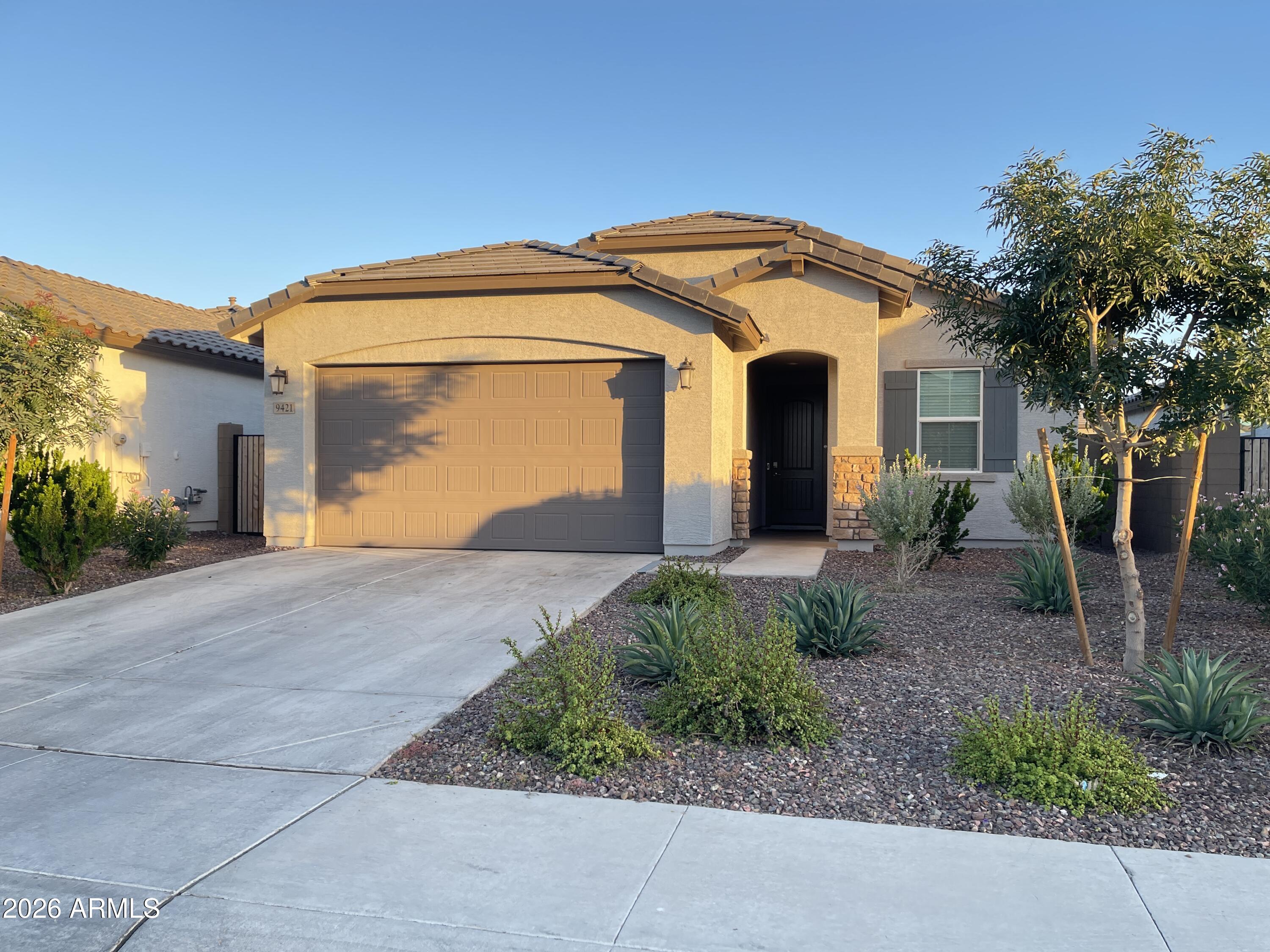 Welcome to this beautiful less than 3 year old house located in the gated community of Western Enclave. Built in October 2023, this 3 bedroom 2 bathroom house displays an open floor plan from family room to dinning area then into the Kitchen. Ideal for everyday living and entertaining. From there you step into the backyard that has been professionally designed with turf and pavers, providing a great outdoor space to entertain relax, play, and enjoy. 2 bedrooms with nice size closet. Master bedroom has  shower, L shape closet for lots of storage. This community offers parks, walking trails, and a dog park for residents to enjoy. Very close to I-10 & Loop 101 with easy access to Westgate Entertainment District, Less than 5 miles from State Farm Stadium, Topgolf, and Tanger Outlets.
