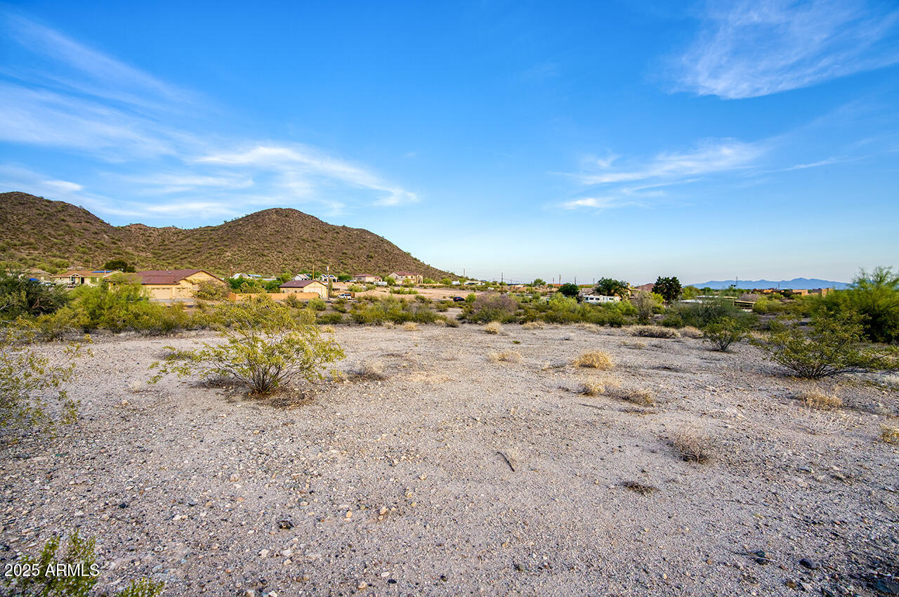 Incredible opportunity to own 2.5 acres in one of North Peoria's most desirable areas. This awesome lot offers mountain views, full paved road access, and is surrounded by custom multi-million-dollar homes. APS power is already on the property. Percolation test and topographical survey have been completed and are available. A City of Peoria waiver is in place, giving you the flexibility to install a private well and septic system or you can connect to city utilities. Property can also be subdivided into two parcels- Ideal for building a custom home on one and selling or developing the other.  Located just minutes from the Four Corners area for easy access to shopping, dining, and entertainment. A rare find with development potential in a premium location.