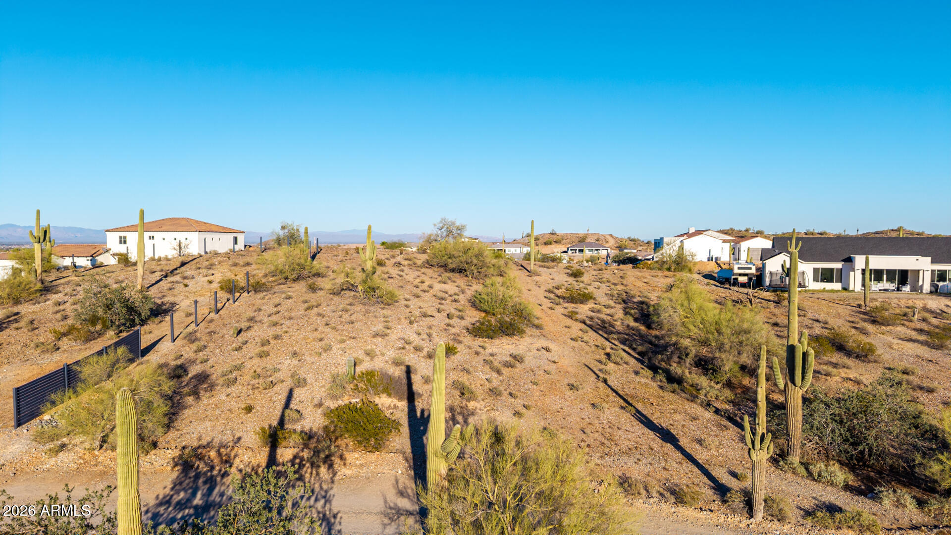 Discover a rare opportunity to own a spectacular 1.25-acre view lot! Featuring wide-open skies, glowing city lights, and fantastic mountain vistas creates the perfect backdrop for your future dream home. This prime custom home site provides the ideal setting to design the home you've always envisioned, with utilities available and no HOA for added flexibility. The property is also designated as a horse property, giving you plenty of space for equestrian amenities or simply enjoying the open desert surroundings. Conveniently located minutes away from golf, schools, and a sprawling 10,000-acre park. Lots like this are becoming increasingly hard to find! Don't miss your chance to make it yours!