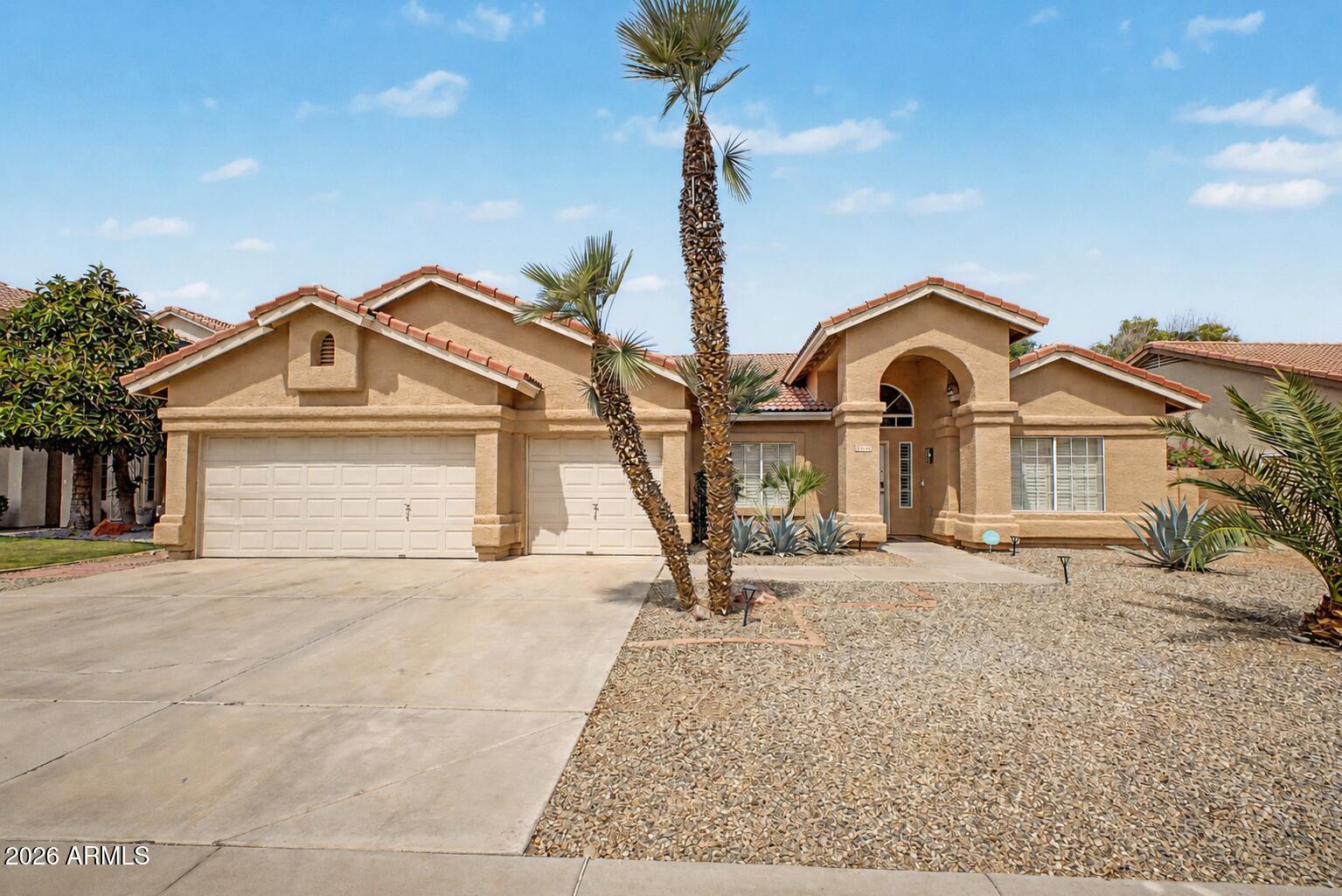 Move-in ready home in Garden Lakes! Recently remodeled in modern, neutral tones, this home offers a seamless blend of style and functionality. Featuring an open floor plan with vaulted ceilings, quartz countertops, and luxury vinyl flooring throughout, the space feels bright and inviting. Major updates include a newer roof (less than 3 years old) and a resurfaced pool with updated equipment and heater, creating a great setup for year-round enjoyment. The private backyard is thoughtfully landscaped with mature palms, fruit trees, and new irrigation, ideal for relaxing or entertaining. Smart home features include a smart front door, garage door, thermostat, and pool controls for added convenience. Seller is open to selling the home fully furnished for an additional fee. such as dishes, towels, and bedding, offering a potential turnkey opportunity!