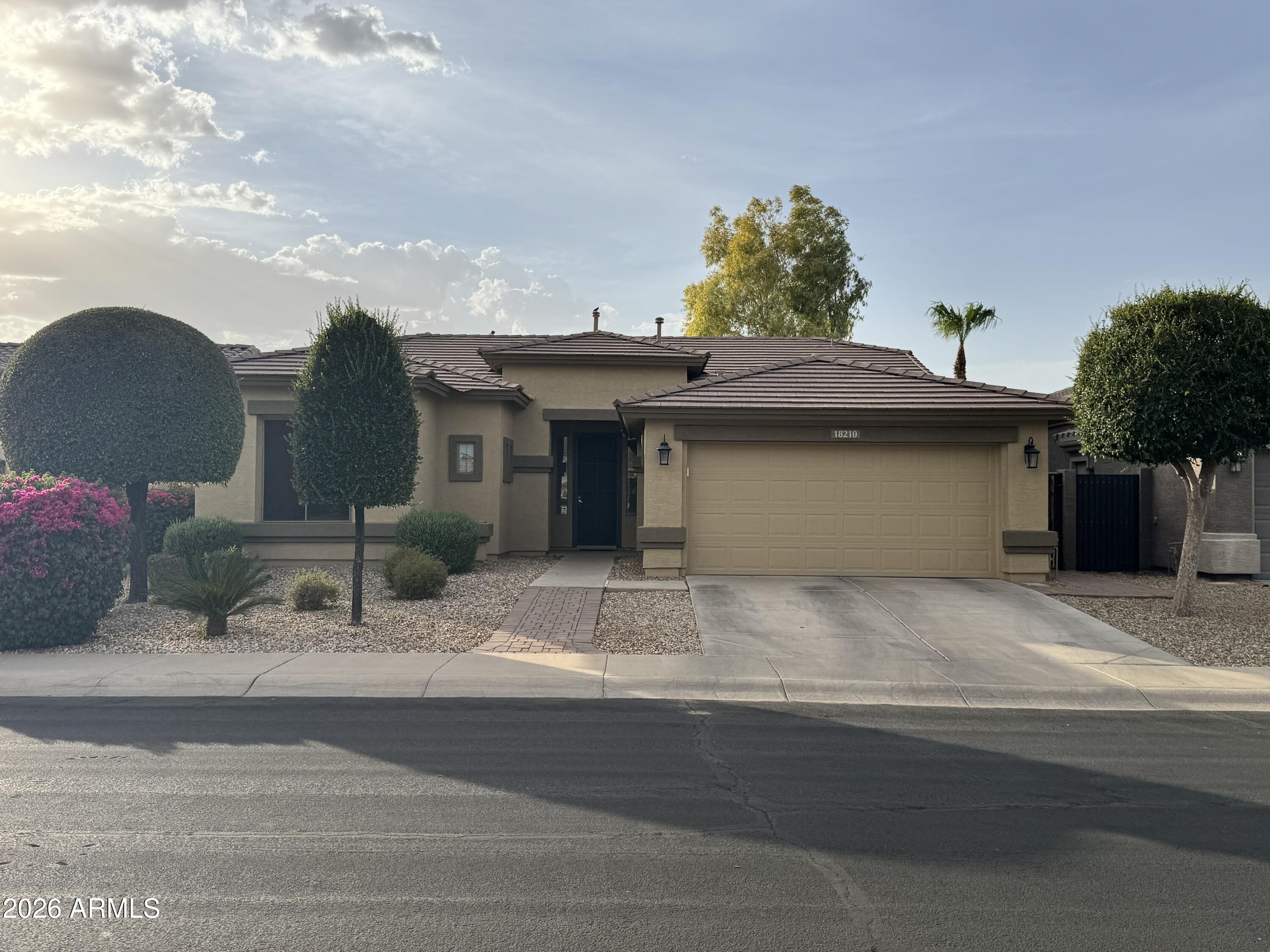 Beautiful home located in the desirable Surprise Farms community! This property boasts a bright, open-concept layout with a split floor plan and an eat-in kitchen perfect for entertaining. The spacious master ensuite features a generous walk-in closet. Additional highlights include a paved walkway, fresh exterior paint, a dedicated laundry room with a built-in sink, a convenient tandem garage, new insulated garage door, newer water heater, and low-maintenance landscaping with a covered backyard patio. Move-in ready and full of charm, come see it today!