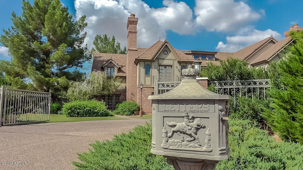 MOTIVATED SELLER! RARE AZ MANSION! Park 20-40 Cars, 1-2 Lrg RV's or Boats, etc. 1.7 ACRE EUROPEAN STYLE ESTATE IN HEART OF SCOTTSDALE! Traditional English Tudor w/ Carriage House! 3 structures w/ 17,000sf livable, 21,000 under roof! BRING ALL THE TOYS! Private Compound enclosed by brick & iron perimeter fencing w/ power gates. Enjoy 17 30-40' trees, grass, fruit trees, roses & Mountain Views! Sparkling  clover leaf shaped pool & spa. Rear structure  built in '09 is 4500sf of flex space currently used as car enthusiasts workshop & artists personal studio. 
Under docs tab see brochure complete w/floor plans &  description of   property. Incredible value at $175/sf! See Documentary under Photos/Video Tabs. See with just 1 hour notice any day of the week! A must see! Also for Rent. MLS# 51907