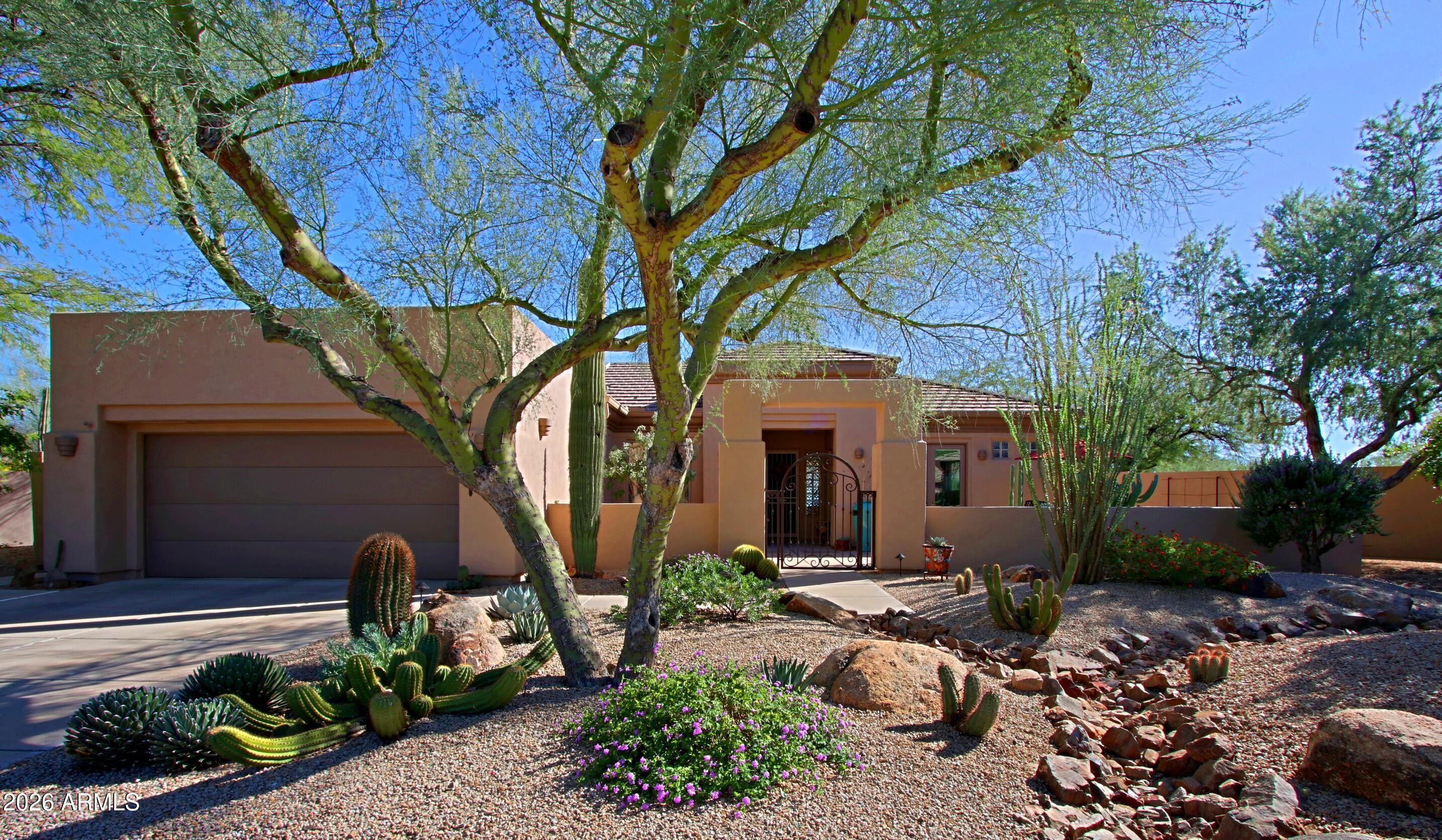 A stunning, open floor plan with many outstanding features which are not common to the developer's original Vaga plan. Ultimate curb appeal on a secluded eight home cul-de-sac, and the views toward Black Mountain are nothing less than exceptional. A natural desert area is a buffer zone from the homes on 66th PL and Sleepy Owl. Entering the home you experience an array of versatile spaces for living and entertaining. Altogether, the open concept kitchen, island's casual space make a convivial setting for family and friends gathering for any occasion. Pella hinged patio doors give access to front patio and clear view to Black Mountain The kitchen features stainless appliances, fashionable granite surfaces, enhanced wood cabinets and water filtration to the sink and refrigerator. MORE A stainless AOG bbq with a generous work surface is accessible from the Pella sliding door . The spacious great room with abundant natural light features purpose built cabinetry, display lighting, mounted TV, and sound surround devices. The window span brings in the ambiance of the backyard's features and vistas. The den readily meets the requirements of business and at-home tasks at the same time a comfortable setting to satisfy private time exploring the internet, or choice literary material. The bedroom wing features a spacious primary suite with refined details and access to the rear yard. The bath presents tastefully updated cabinetry, granite vanities, lighting and frameless shower. A spectacular walk-in closet was designed by California Closets likely resulting in one of the more functional closets for this model in Terravita. Set off by the custom tri-fold door, the guest bedroom offers private and comfortable accommodations. Garage features include a new hot water heater, soft water system, garage cabinets and an overhead storage rack for sunscreens. Tour the grounds and experience an array of amenities: landscape lighting, travertine tile patio and a gated front patio. An extraordinary home. Buyers can obtain most furnishings at nominal expense.
MORE:
Wolf 4-burner cooktop
Glass subway tile backsplash
Customized pantry
Roll-out shelving
Dimmer controlled lighting
Top Knob hardware
Retractable exterior screen with remote
38"x68" window in the dining area
Smoke detector units
Surround sound
Ceiling speakers
Granite counters
Garage cabinets
Filtered water system
Whole house water shut-off
Rain gutters