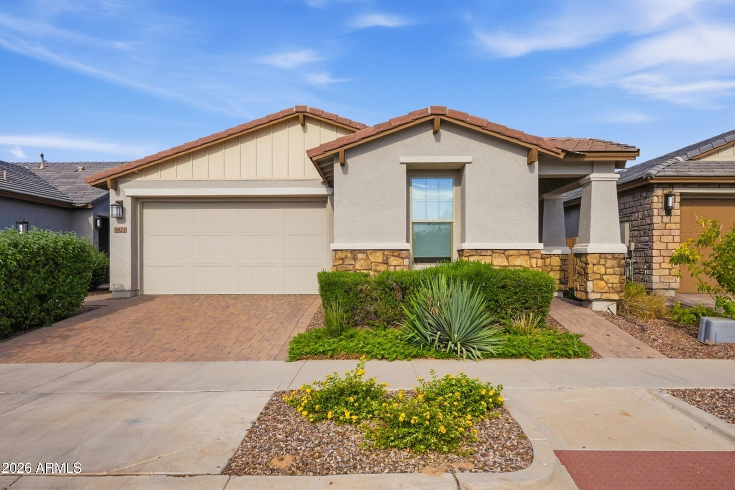 Discover this upgraded 55+ home in Encore at Eastmark. This spacious split-floor plan centers around an open great room that transitions to your outdoor space via 3-panel accordion style sliding doors. It features 2 bedrooms, 2 baths, a den, great room, and a dining room. The kitchen shines with granite counters, a large island, maple cabinets, and stainless steel appliances.

Retreat to the private, extended primary suite offering double sinks and a large shower with a bench. Outside, enjoy a covered patio, a built-in BBQ for outdoor cooking, and a grassy backyard. A 2-foot extended epoxy garage easily accommodates larger vehicles.

The community center offers a fitness hub, café, billiards, a pottery room with kilns, tennis, pickleball, and a soon to be new state-of-the-art pool.