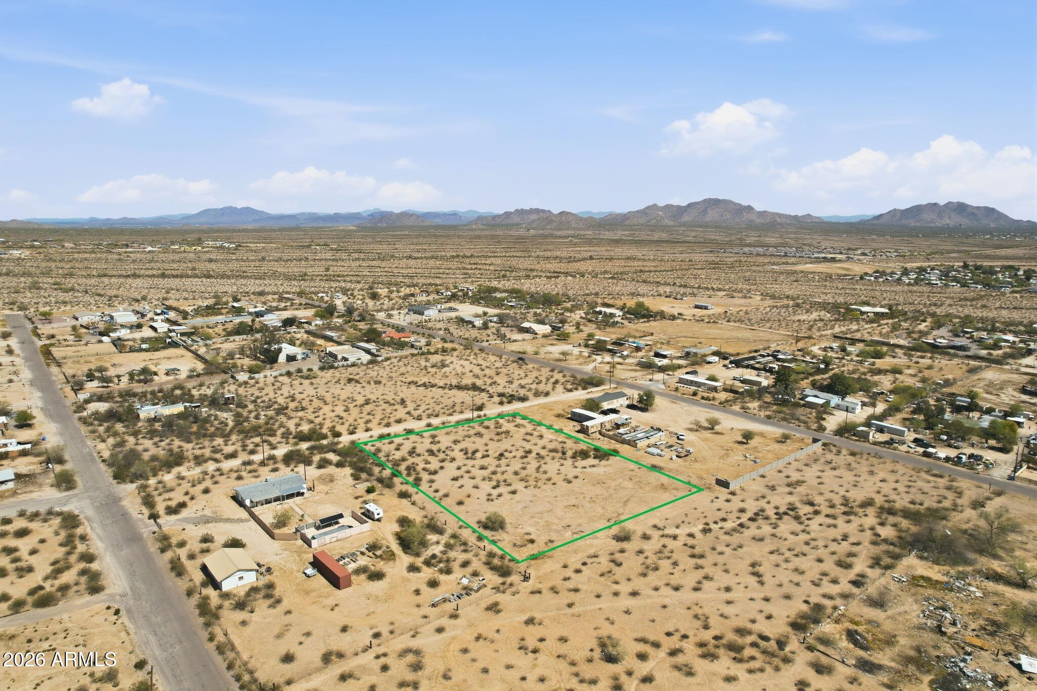Build-ready 1.52-acre parcel in a growing Casa Grande location! This flat, usable lot sits between two existing homes on W. Watson Way with power at the lot line and water available nearby (buyer to verify connection options). Enjoy mountain views, open desert surroundings, horse privileges, and no HOA. Perfect for a custom home, workshop, small ranch, or future expansion. Convenient access to nearby amenities while offering plenty of room to spread out. . Buyer to verify acreage, utilities, zoning, and all material facts.