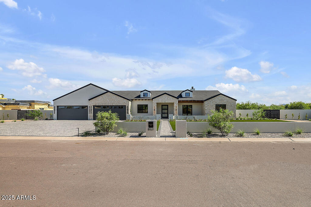 Welcome to Milco Development's latest luxury residence. An expansive modern farmhouse nestled on over an acre in the prestigious Cactus Corridor of Scottsdale. This stunning property has been built for the way families live today, featuring 6 bedrooms, 8 bathrooms, a 6-car garage, and plenty of room for all your toys. Step inside and you're greeted by soaring ceilings, natural light, and an open layout that feels both luxurious and livable. The heart of the home is a stunning gourmet kitchen featuring Sub-Zero, Wolf, and Cove appliances, along with a fully equipped butler's pantry, perfect for weeknight dinners or weekend entertaining. Overlooking the spacious living and dining areas, so you're always part of the conversation. With five bedrooms, five baths, and 2 powder baths in the main house, everyone gets their own spaceand every bedroom has its own en-suite, making mornings a breeze. The separate living area provides kids or guests with a space to unwind, and there's room for everyone to feel at home. Step outside, and the real magic happens. A sparkling pool, relaxing spa, Pickleball Court, and a private 1-bed/1-bath guest house make the backyard an everyday retreat. Whether it's summer BBQs, weekend Pickleball tournaments, or quiet evenings under the stars, this space has it all. Just minutes from shopping, dining, and everything you need, this home isn't just beautiful, it's built for your life.