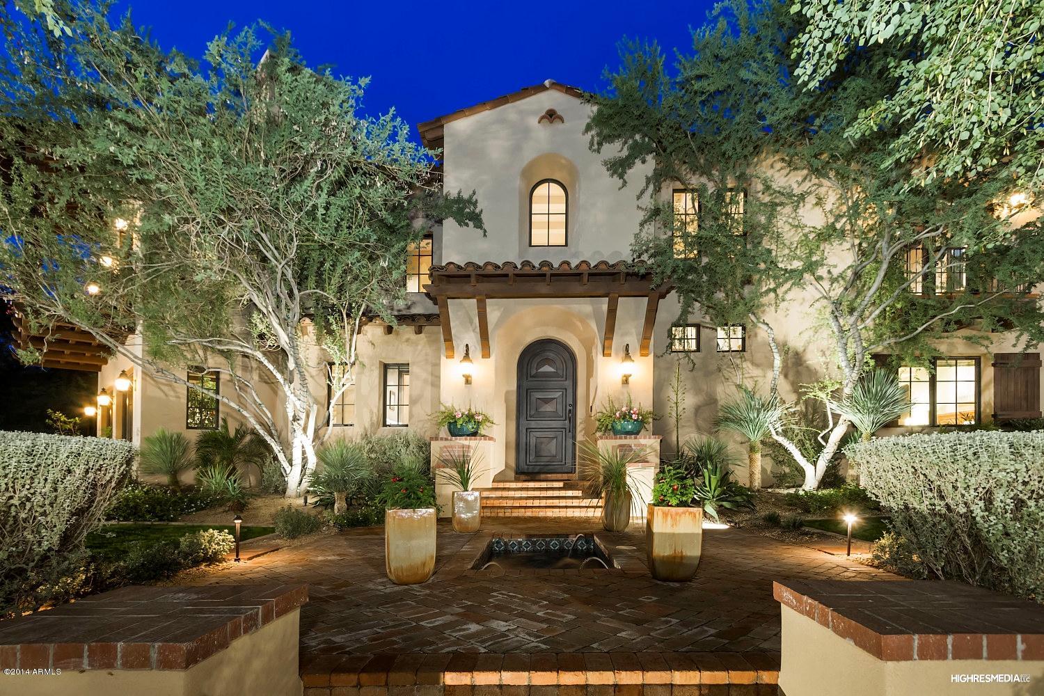 Gorgeous estate in prestigious Arcadia at Silverleaf provides modern amenities one would expect in a home of this caliber. Situated on a larger corner lot on the main park, this courtyard home provides the perfect family retreat and entertainers dream. Designed by Mark Candelaria and flawlessly built by John Schultz, understated and simply elegant with subtle stone, wood and brick accents, this home offers gracious luxury living. This exquisite home features an 1140 bottle wine cellar, elevator, front & back wood staircases, handsome millwork enhanced office, additional family room/billiards room complete with kitchenette, sprawling master suite enhanced by Italian fireplace, gourmet chef's kitchen includes 2 butler pantries and fireplace, the full service bar transitions to a warm family and inviting family room with hand-carved beamed ceiling and hand hewn wood floors.  The formal living room has its own large wet bar and hand carved Macedonia limestone fireplace from the Yucatan, and the formal dining room comfortably holds a table set for 12. Elegant cantilever balconies sweep the back courtyard encompassing the lap pool, spa, fire pit, custom Spanish fountain and outdoor cooking. Patio surfaces are a combination of old tumbled brick and exotic limestone imported from India. This is an exceptional opportunity to live close to everything including golf, dining, shopping, schools and hiking in the exclusive gated community of Silverleaf in DC Ranch.