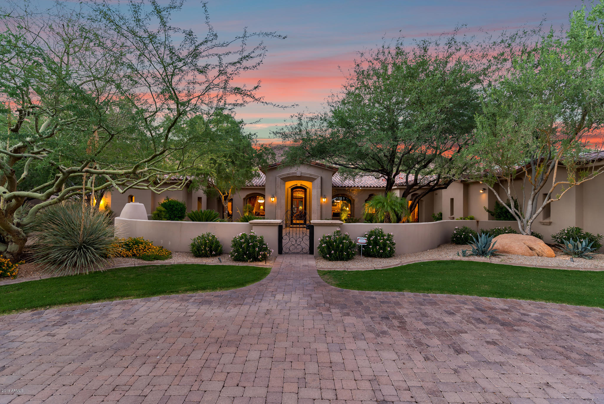 Exceptional estate located in one of Paradise Valley's most sought after locations, Acre+ corner lot surrounded by mountain views this meticulously maintained home shows like new, Large courtyard opens to main home featuring  5 en suite bedrooms, 2 offices and media room, Gourmet kitchen with center island and gas stove, opens to fabulous family room with full bar & wine room, game room, coffered ceilings, master suite w/ gas fireplace w/ amazing His & Her walk-in closets,2 showers(one steam &  office, Separate Guest house w bedroom bath, kitchen & living room, Resort style backyard with salt water heated pool/spa, Putting green, Great covered patio with fireplace &,BBQ,Gated auto court with air conditioned 4 car garage, Incredible corner lot great mountain views, 4 new HVAC's 2019. More.. floor plan under document tab
Air purifying system -2019

2 2019 -5 ton 16 seer 2019 ac units (main House
 
Guest house-  2 ton 15 seer unit August 2019
New Garage HVAC- 3 ton August 2019
10 year warranty on above
Master side HVAC unit 2 yrs old
