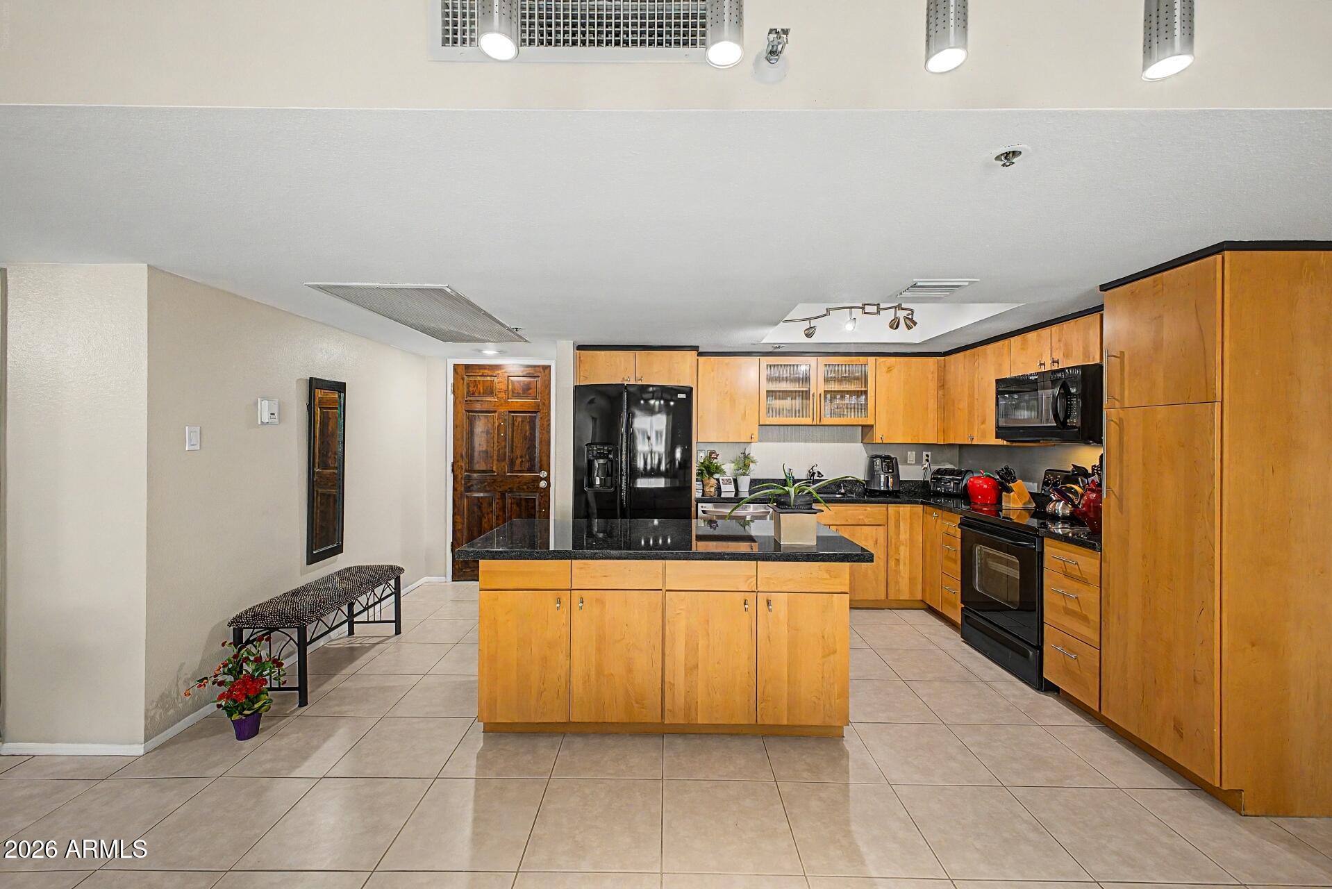 One of the only units in Scottsdale Shadows with an in-unit laundry room -- washer and dryer included, no shared laundry required! Unit 309 in Building 31 is a true 2 bed, 2 bath with an open-concept layout, remodeled kitchen, spacious primary bedroom with walk-in closet, and a screened-in balcony. Freshly painted in March 2025 and move-in ready. Scottsdale Shadows backs it all up with resort-style amenities: a PRIVATE 9-hole executive golf course, 3 heated pools, spas, tennis courts, fitness centers, sauna, art studio, woodworking shop, and a 24-hour guard-gated entrance. HOA covers AC, heat, water, and trash. All of it steps from Old Town Scottsdale and Fashion Square.