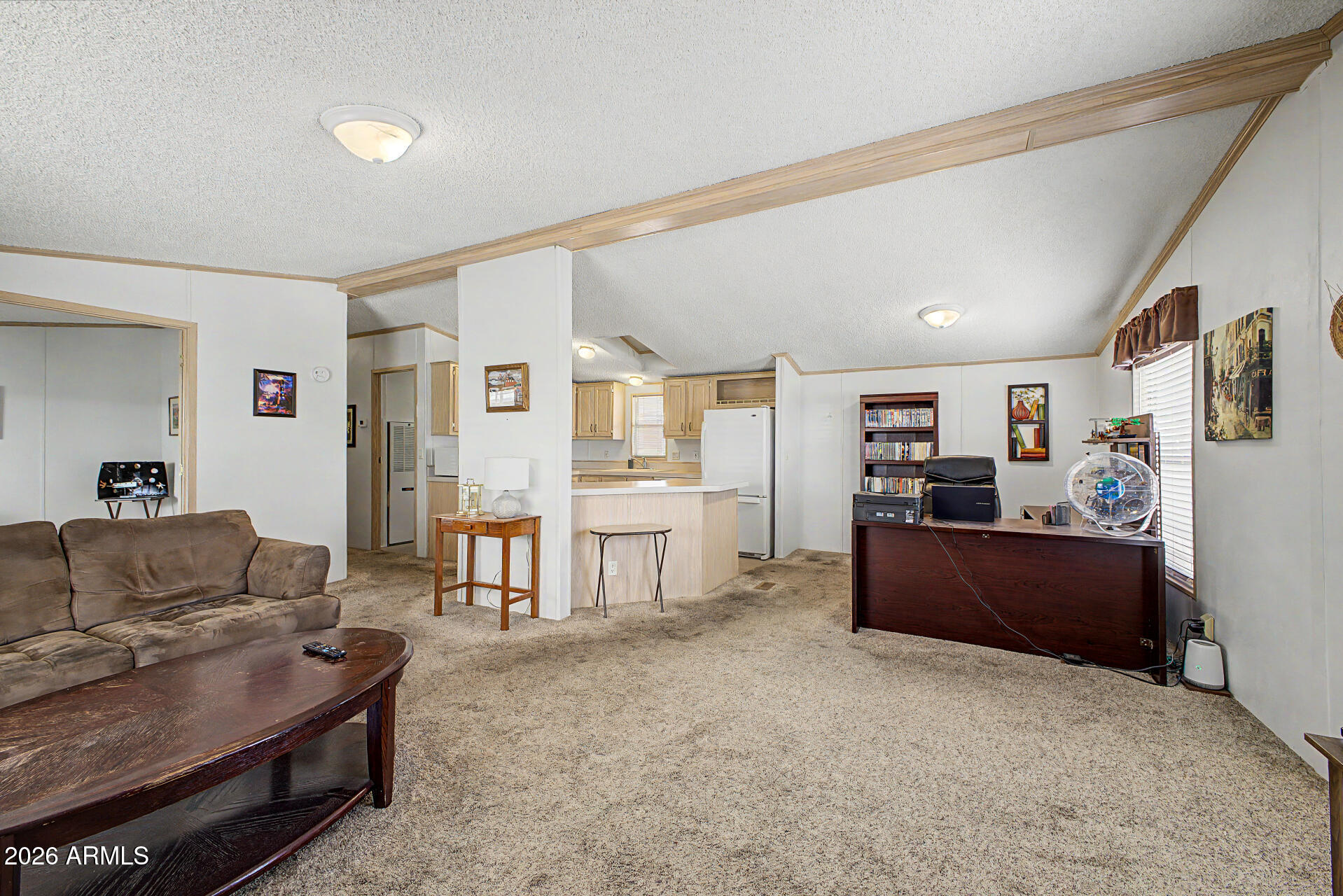 Charming and beautiful 2 BR 2BA +DEN doublewide has everything. Located in a guard-gated and well maintained 55+ community featuring a heated pool & spa, pitch & putt golf, clubhouse, workout facility, billiards, cards, library, pickleball, horseshoes, shuffleboard & many more activities. Amazing views of the incredible Superstition Mountains. For pet lovers an onsite dog park ensures they feel right at home. Conveniently located close to shopping medical facilities and freeway access. Updates include a new HVAC in July 2025, new shingle roof in 2019 and 4 yr old carpet. Separate laundry room open kitchen w/center island & breakfast bar create a space that is functional & fun. Exterior features includes a large storage shed, steps on both sides. Ideal full time home or seasonal getaway! Look at how close it is to the clubhouse and community features!  Front TV antenna will be removed prior to closing.  Thank you for looking!