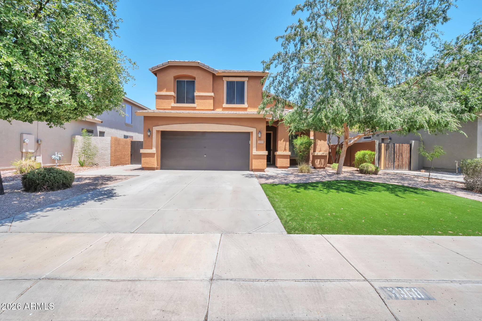Welcome to Seville! This 4-bedroom, 3-bath home offers a versatile floor plan with a bedroom and full bath on the main level, ideal for guests, multigenerational living, or a home office. Enjoy a formal living area plus an open-concept kitchen and great room perfect for entertaining. The backyard features a sparkling pool and an extended covered patio spanning the length of the home for year-round Arizona living. Additional features include tile flooring in the kitchen and baths, carpet in living areas and bedrooms, and a 2-car garage with a 220-volt outlet that may accommodate an EV charger. Conveniently located near parks, golf, shopping, dining, and top-rated schools.