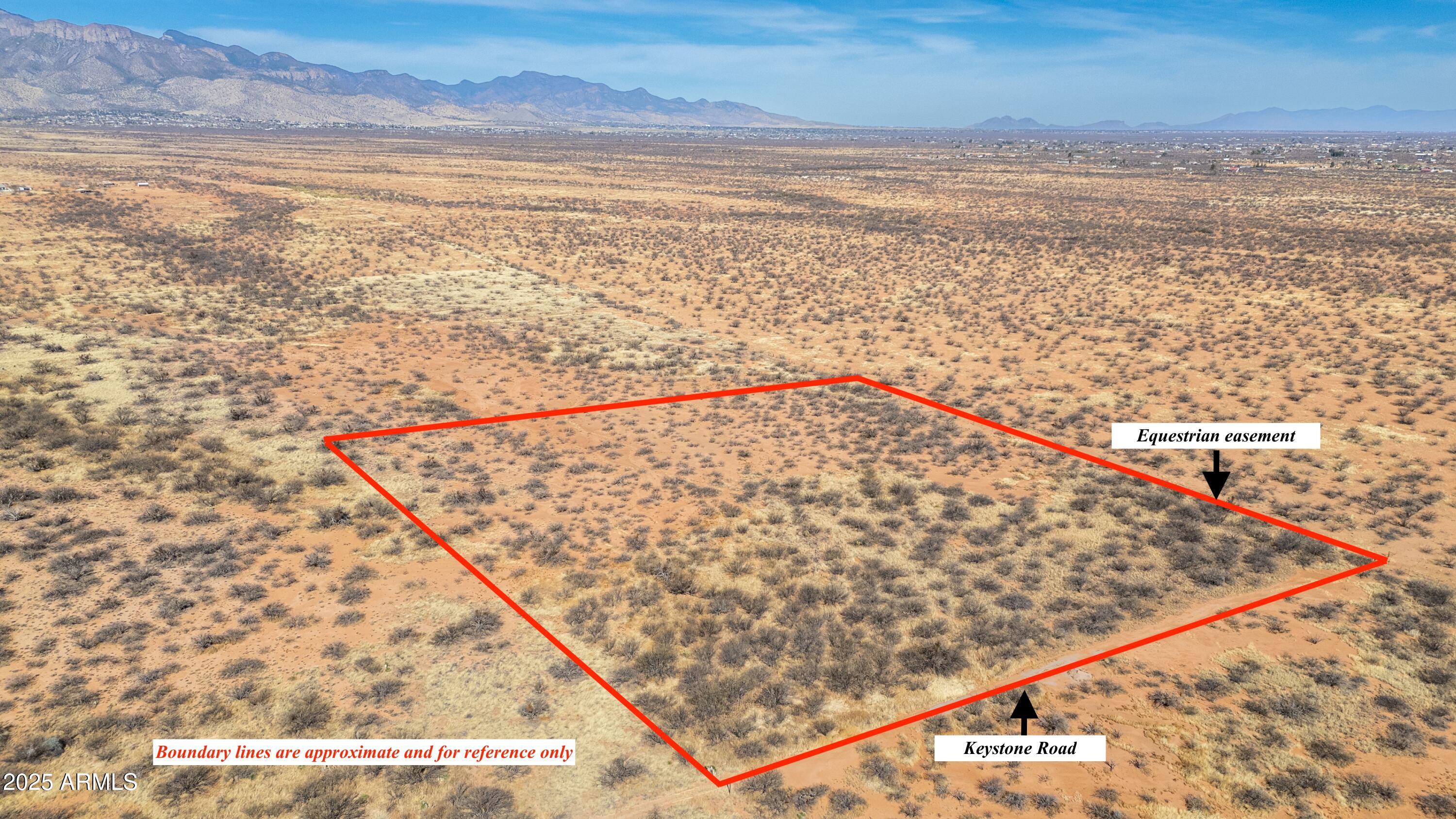 Quiet Remote 8+ Acres of land in prestigious 3 Canyons. Spectacular mountain views of the Huachuca's, Mules, & San Jose Mountains. Lots of Trees! Bring your animals, build your dream home on this secluded parcel! An additional 8.01 acre parcel is available adjacent to the south boundary.