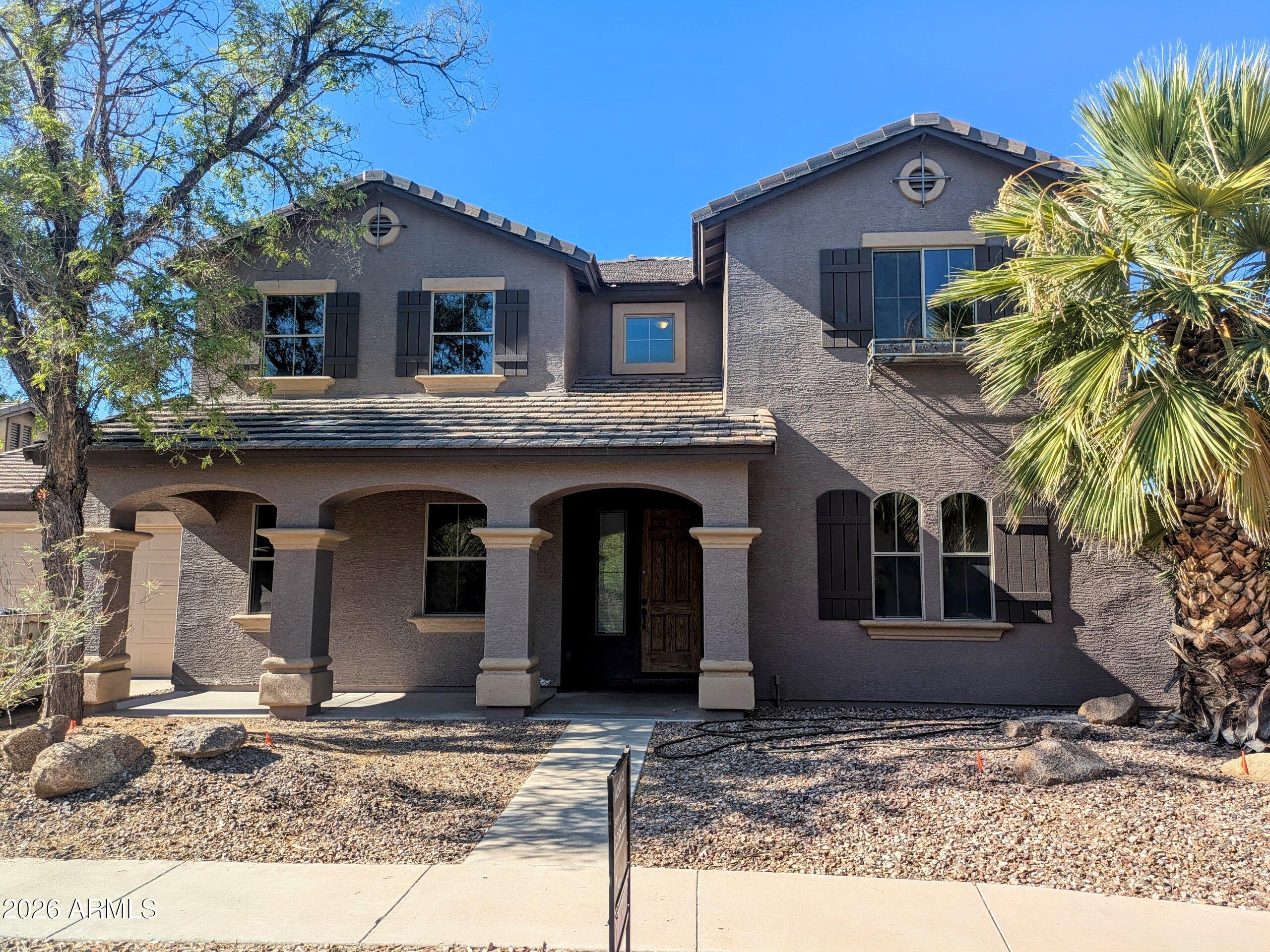 Welcome to this beautiful, spacious 5-bedroom main home nestled on a premium corner lot in Surprise's desirable Mountain Gate community. Available for lease at $2950 a month, this expansive 4,091-square-foot residence offers the ultimate layout for comfortable living. This listing is for the main house only, as a separate, occupied guest house is on site. Inside, you'll love the grand 31x15 family room with a fireplace, a chef's kitchen with granite countertops, and a massive upstairs bonus room. The layout features a convenient main-floor bedroom and full bath, while the upstairs primary suite boasts a relaxing two-person soaking tub. Complete with a 3-car garage and a lovely covered patio, this home is ready to welcome you!