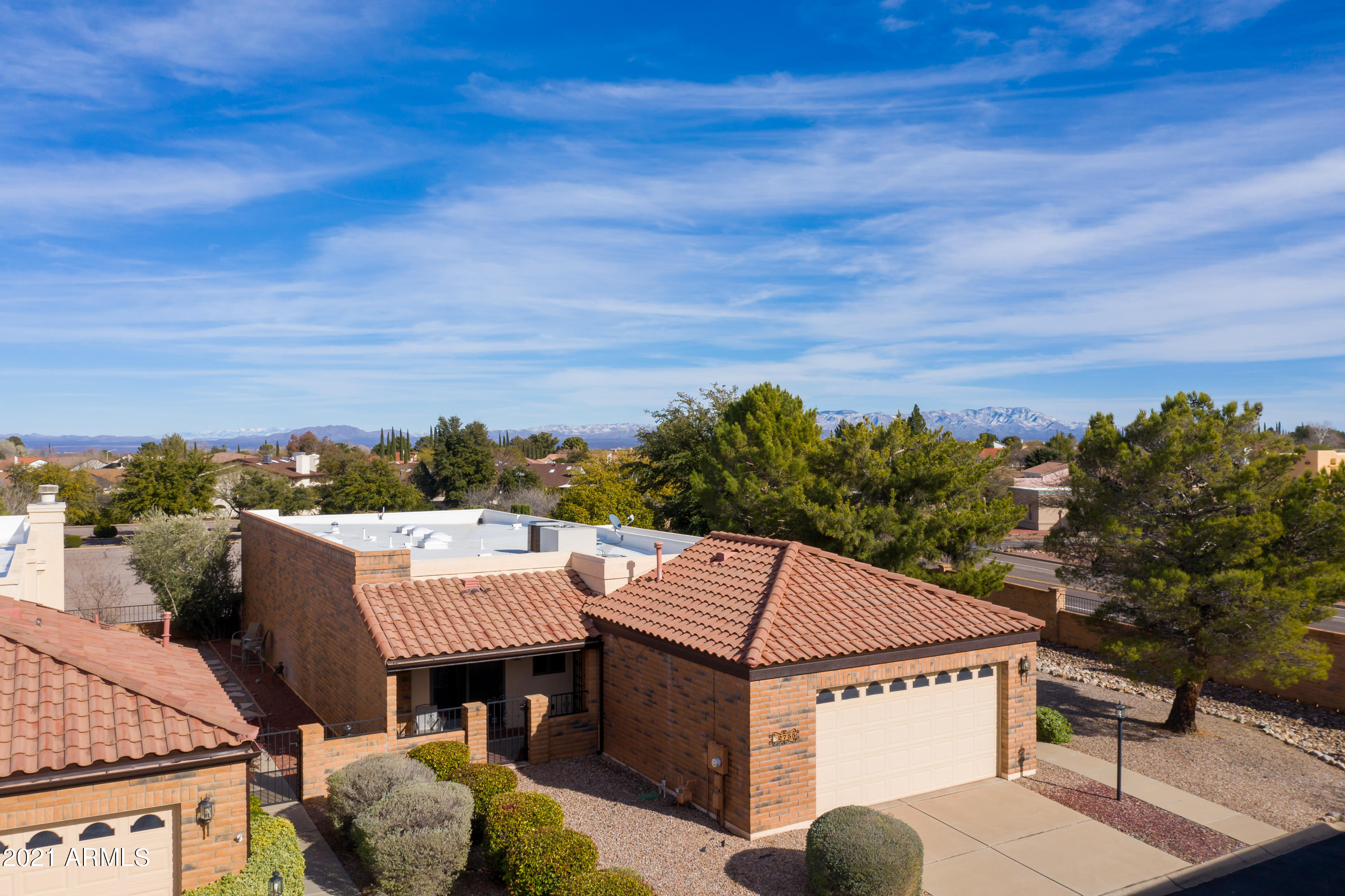 One of the largest lots in Mission Shadows, and backs to the Country club parking lot.  As the large front yard is facing St. Andrews, it is very quiet and private.  Lovely floor plan with lots of skylights and natural light.  Custom bull nose granite in kitchen, private patio off guest bedroom.  Fresh paint, All tile interior.  Huge walk in closet in Master.  In home vacuum system.  Mature landscaping, community pool.  A must see!