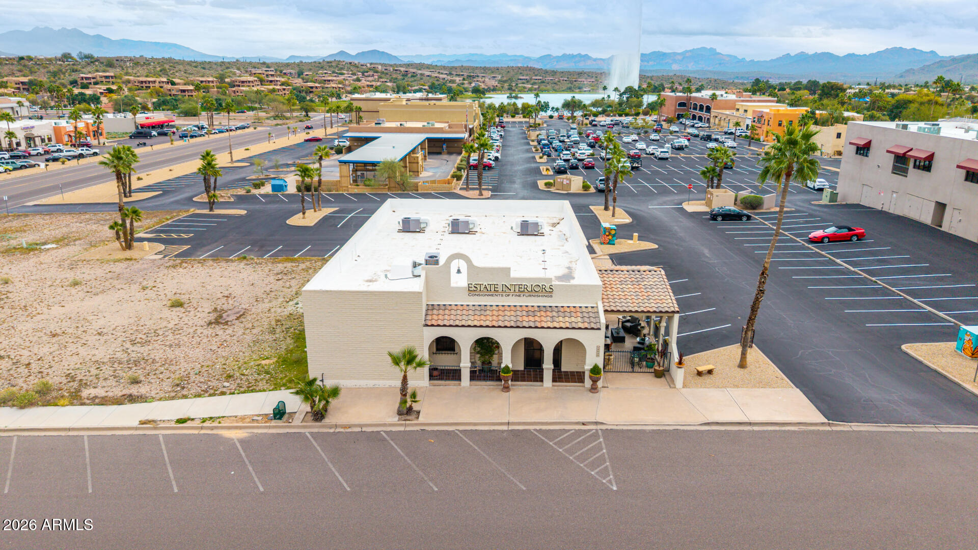 Rare opportunity to own a one-of-a-kind commercial property in the heart of downtown Fountain Hills, just one block from the iconic Fountain with breathtaking mountain views. Currently home to an operating consignment business, this beautifully updated building blends character with modern functionality. Interior highlights include polished concrete floors, recessed lighting, neutral finishes, and an open-concept layout. Extensive 2022 improvements feature a new foam roof, four new HVAC units, renovated bathrooms, upgraded lighting, and expanded rear suites. Douglas Fir beams, iron trellises, custom gates, and a renovated workspace with kitchen amenities complete this exceptional investment opportunity in one of Fountain Hills' most sought-after locations.