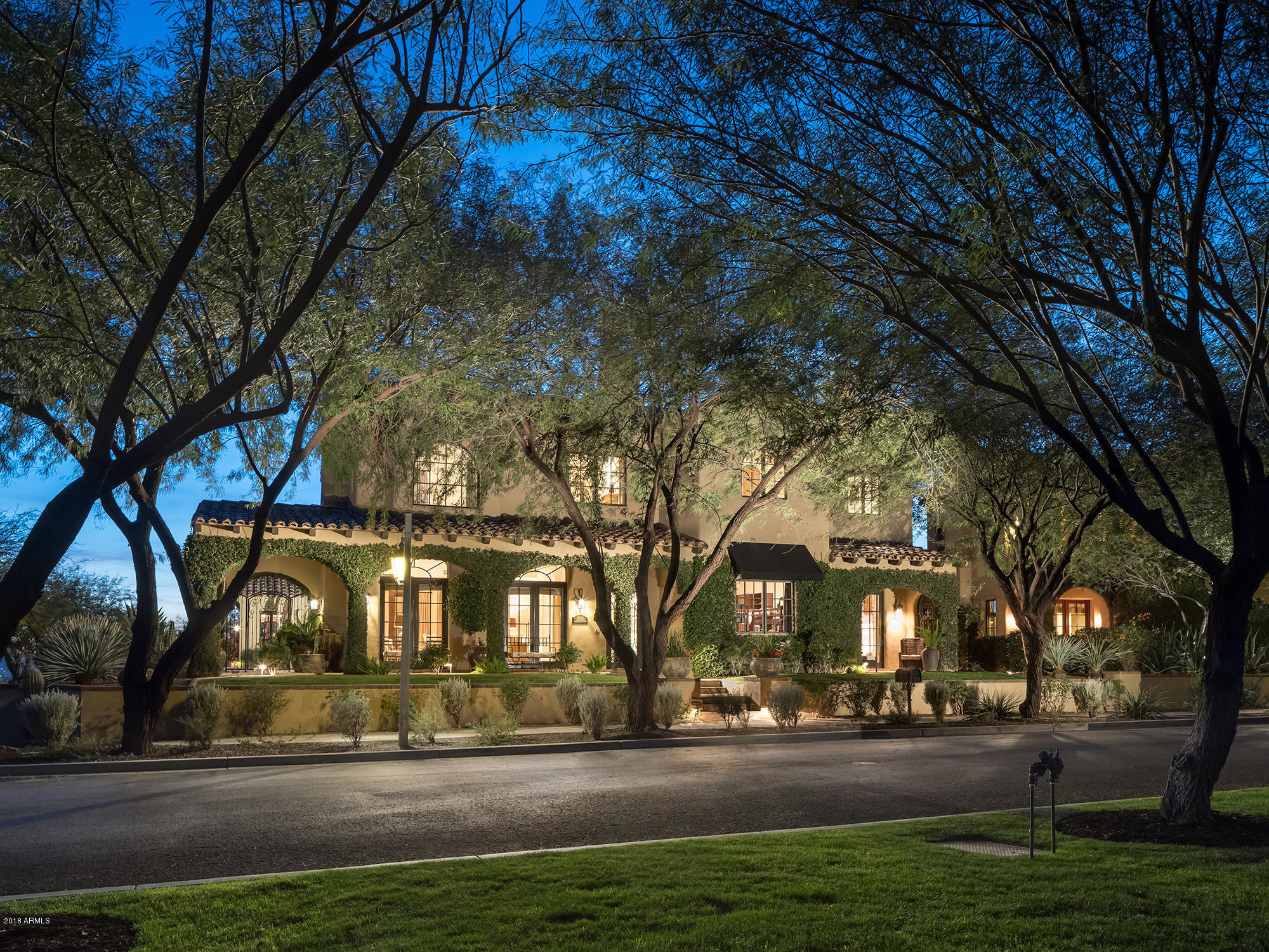 The location of this charming 5,581 SF home is certainly one of the premier spots in The Parks at Silverleaf. Sitting across the street from the Desert Springs Park lake and adjacent to open space, golf, hiking trails and endless views, it doesn't get much better, or more private. This custom home has the quality finishes one expects and a floorplan that meets the needs of most any family. The living room will be used, as it flows out to a covered patio on the park, while the kitchen and family room access the pool and open space. Additionally the home includes 4 beds and 4.5 baths, a spacious attached guest casita, dining room, office, putting green and multiple outdoor patios. This home exudes the warmth, style, comfort and value so desirable in today's market. And don't forget privacy