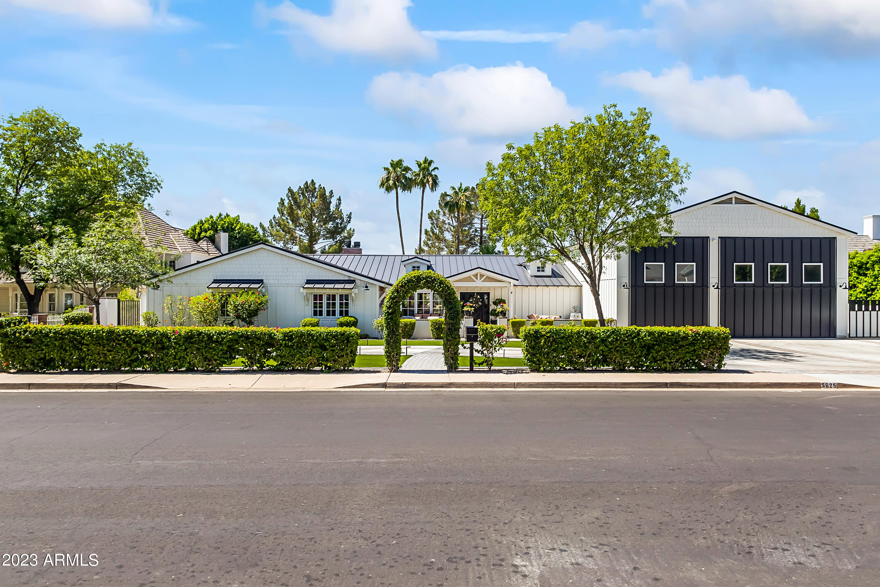 Arcadia proper cottage style 5 bed, 6 bath house on the most desirable street. Enter through custom Dutch entry door into vintage wood flooring, beamed ceilings, & chef's kitchen with custom cabinetry, Carrera marble counter tops, high end appliances, 2 dishwashers, farmhouse sink, & walk-in pantry with 2nd fridge. Primary suite includes fireplace, oversized closet, dual sink vanity, and walk-in shower with clawfoot tub. Wall of glass sliders open to resort style backyard with heated pebble tec pool/spa, covered patio, private cabana, fire pit, & mature landscaping. Add'l rooms include massive laundry room and wine room. Prime location to beach bike bike to and from all the best shops, restaurants and amenities that both Arcadia and Old Town Scottsdale have to offer.
