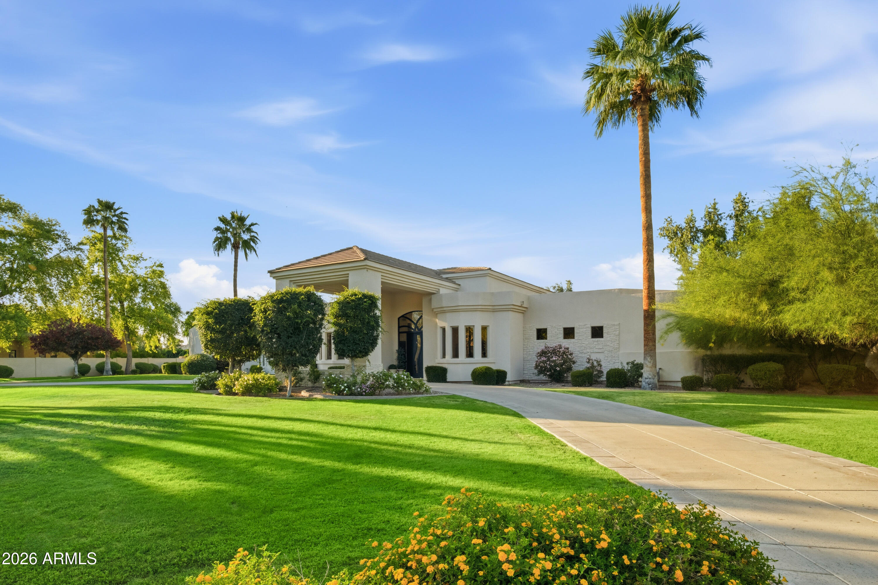 Exceptional opportunity to secure a private retreat within one of Paradise Valley's most prestigious enclaves. Perfectly positioned on a peaceful, tree-lined street, yet moments from Scottsdale's finest shopping and dining, this elegant home in Doubletree Estates offers both seclusion and convenience. A stunning, light-filled living room features soaring ceilings, refined wall detailing and expansive windows framing breathtaking views of the resort style backyard. Inviting and refined, the soft contemporary home continues with an open and bright kitchen, large island and bar, seamlessly connecting to a striking family room, grand fireplace and beautiful glass doors that create indoor/outdoor living. The sophisticated and newly updated primary suite offers a floor-to-ceiling fireplace and panoramic glass doors overlooking the stunning backyard oasis. Enjoy modern luxury in the newly renovated master bath with double walk-in closets. Two additional updated ensuite bedrooms add a touch of modern luxury throughout. The home offers an additional office and flex space ideal for a fitness area or playroom etc.

Step outside to experience beautifully paver-ed patios that extend across the entire backyard, creating multiple areas for relaxation and entertaining. The expansive outdoor spaces are perfect for hosting large gatherings- all set against a backdrop of resort-style grounds that feature a generous pool, elegant ramada with fireplace and outdoor kitchen with expansive bar seating. You'll also discover stunning mountain and sunset views from the rooftop deck.

If you are seeking an elevated living experience, this residence delivers a timeless style and unparalleled sophistication. Expansion plans available upon request.