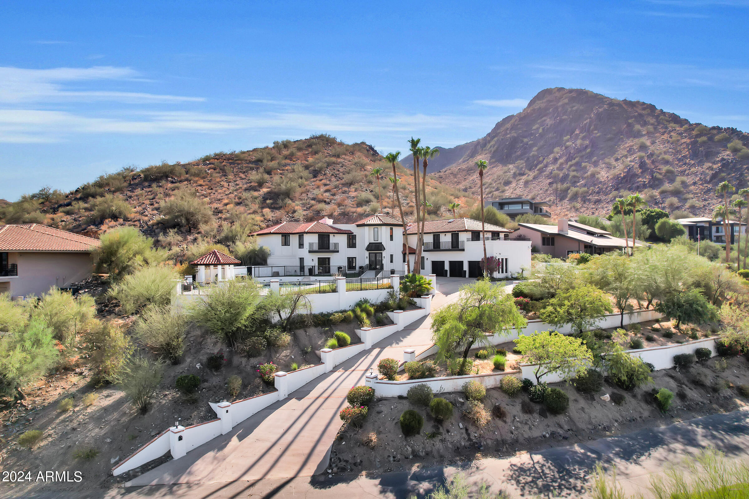 Introducing the Best Priced Home in Paradise Valley, offering breathtaking mountain and city views! This rare hillside gem features a huge flat grass lawn, a large pool, and an oversized 3-car garage with ample storage, a workbench, and RV slab parking—a truly unique find in this area.

The home boasts 4 en-suite bedrooms plus a versatile bonus room perfect for an office or gym. The updated kitchen and bathrooms, along with an enormous master closet and high-end Sub-Zero appliances, make it completely move-in ready.

Situated on a private and quiet lot that backs to the stunning Phoenix Mountain Preserve, the views here are truly unmatched. And with no HOA, this property could also serve as an extraordinary vacation rental opportunity or the perfect lock and leave home.