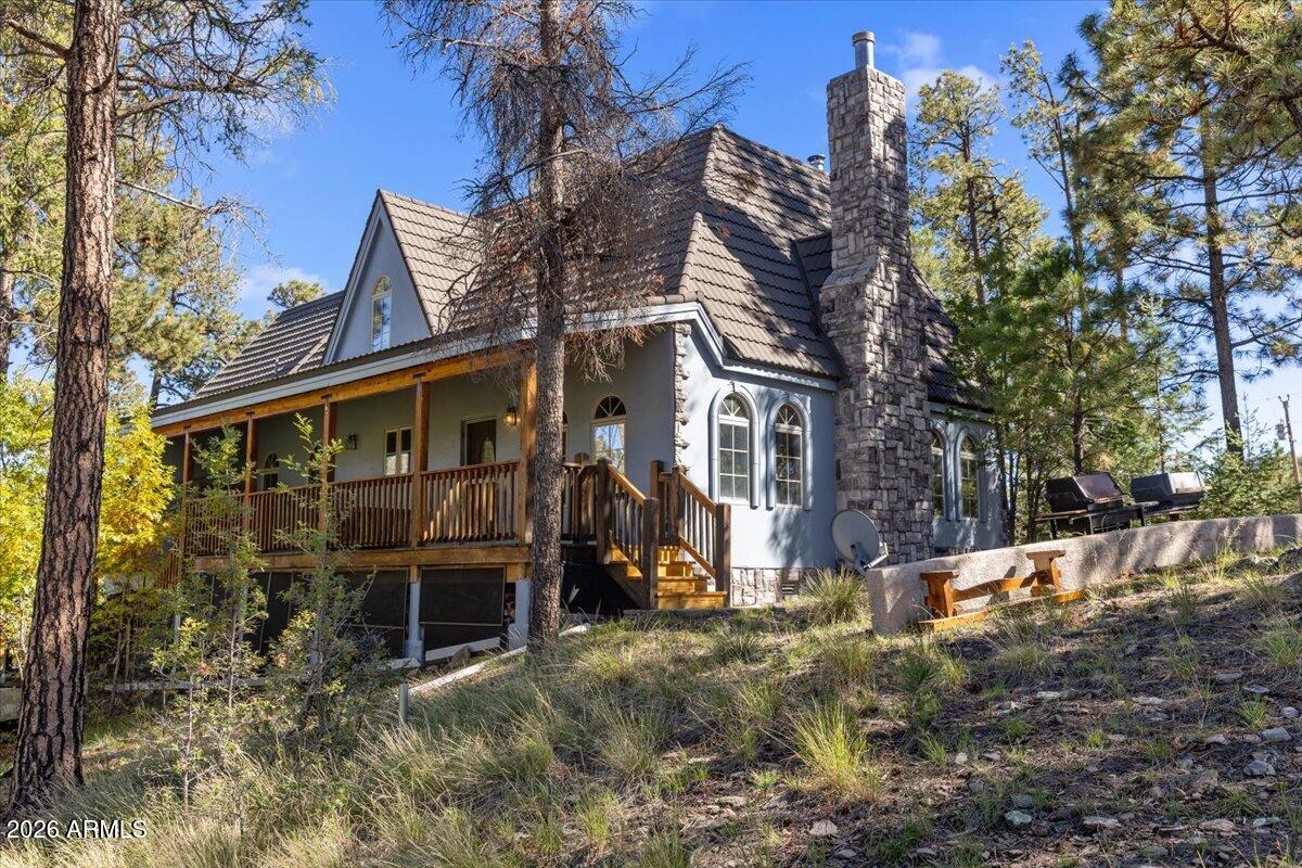 Custom built European-Inspired Mountain Chalet with striking stone exterior and unique architectural design throughout. This 4 bedroom, 3 bathroom home offers a rare blend of craftsmanship, character, and setting on .85 acres with mountain views. The interior features a bright, open great room with soaring vaulted ceilings finished in warm tongue-and-groove wood, complemented by expansive arched windows that flood the space with natural light from multiple directions. The layout flows easily from the living area into the dining space and kitchen. The primary suite stands out with its distinctive architectural design and thoughtful layout. Additional features include a 3-car garage and a well-positioned homesite with no HOA. Located just minutes from Alpine's town center, with easy access to national forest, lakes, and year-round outdoor recreation. Ideal for a full-time residence or mountain getaway. The adjacent lot is also available for purchase.  There is a CCR summary page in documents tab and the remaining CCR'S upon request.