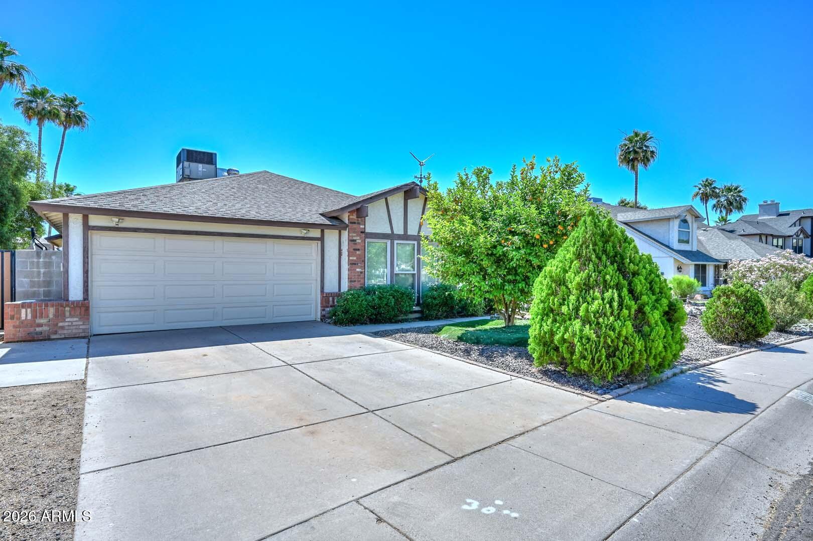 NO HOA home features a split floor plan with 4 bedrooms and 2 baths. The interior has a formal living room and a dedicated formal dining room, perfect for hosting. Enjoy the eat-in kitchen, complete with a convenient breakfast bar for casual dining. The private primary suite is tucked away for ultimate privacy. Your backyard oasis awaits, featuring a sparkling pool, lush green grass area, and a versatile storage building. Lower your utility bills with the solar system. This property offers an unbeatable location just minutes from ASU West Campus and Banner Thunderbird Medical Center. Welcome home!