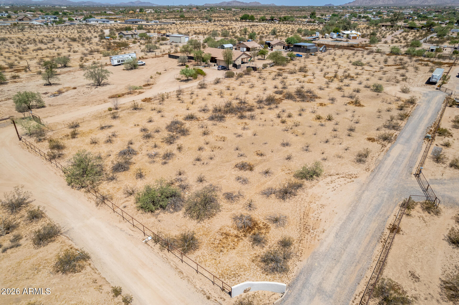 What a RARE find! Nestled on 3.36 scenic acres, this centrally located desert property offers the perfect setting to build your custom dream home. Enjoy breathtaking mountain and city views while benefiting from convenient access to I-10. With no HOA, you'll have the freedom to bring your RV, off-road vehicles, and other recreational toys, and horses are welcome too. Whether you're looking for wide-open space, stunning sunsets, or easy access to nearby amenities, this exceptional property offers the best of Arizona desert living. Don't miss this incredible opportunity!