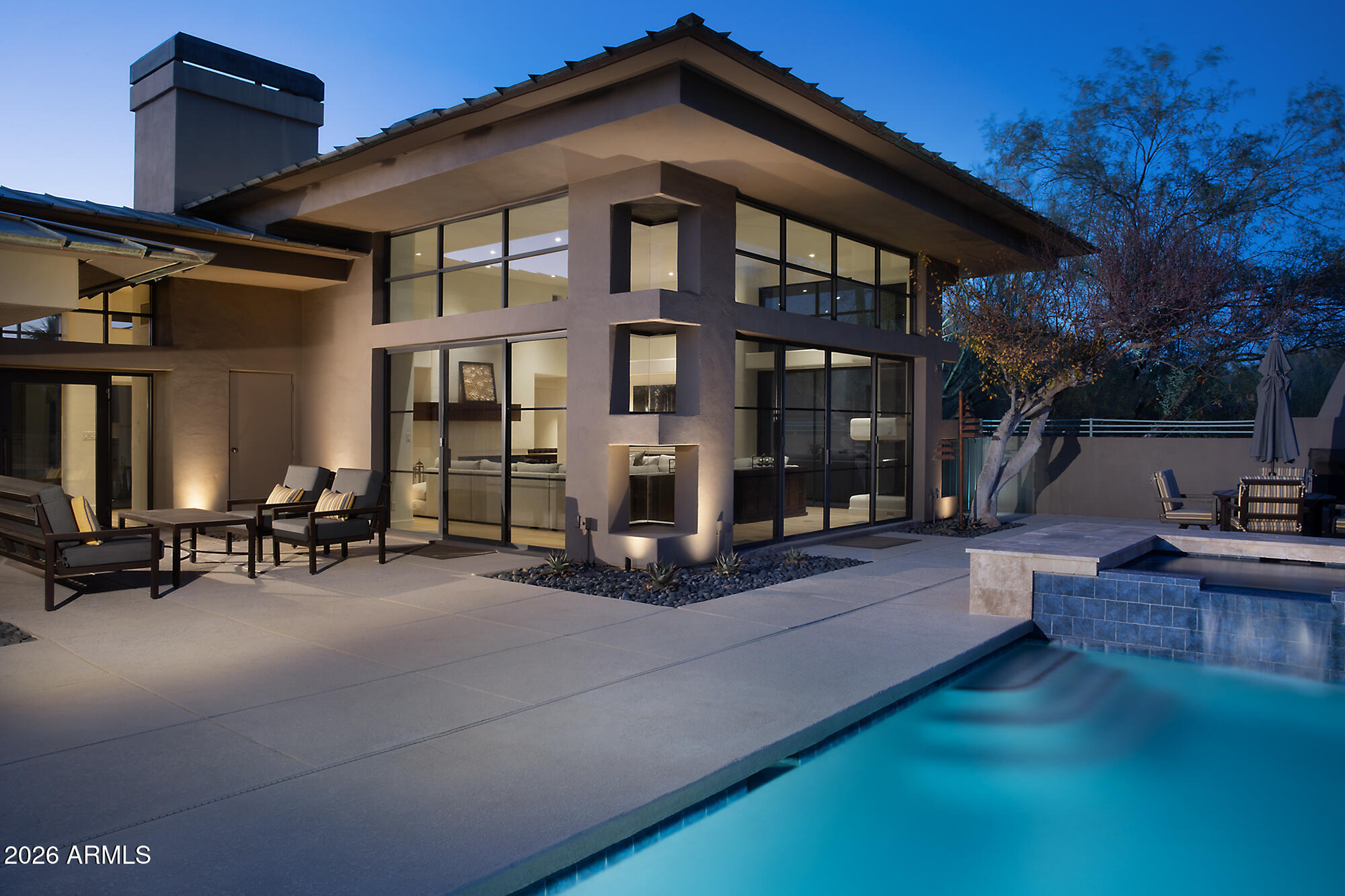 IMMEDIATE GOLF MEMBERSHIP AT CLOSING. This one of a kind contemporary was exquisitely designed by Frank Lloyd Wright protege Howard Madole. It has floor to ceiling windows and doors bringing the outdoors, indoors. The 4,288/sf home is all on one floor except for an upstairs loft, perfect for an art studio or children's play room, with  access to view deck. The Great room with fireplace has near ceiling high windows that overlooks the pool.The home has been extensively upgraded (see upgrade list in Document Tab) with a posh kitchen and adjacent breakfast room. The primary suite has sitting room and a remodeled spa-like wet-room bath with tub and shower. There is a total of 3 bedrooms and 3.5 baths. The resort-like backyard has a spacious patio, heated pool and spa, fireplace and BBQ.... overlooking beautiful mountain views and the Sonoran desert, Desert Highlands Golf Club is a Designated a top 'Platinum Club of America'' golf club, Desert Highlands amenities include a Jack Nicklaus championship golf course, 18-hole putting course, award winning clubhouse featuring ''Jacks'' gastro pub, state of the art fitness center, Highlands Racquet Club featuring grass, clay & pickleball courts,& more. A $205,000 membership fee is due from buyer at close of escrow