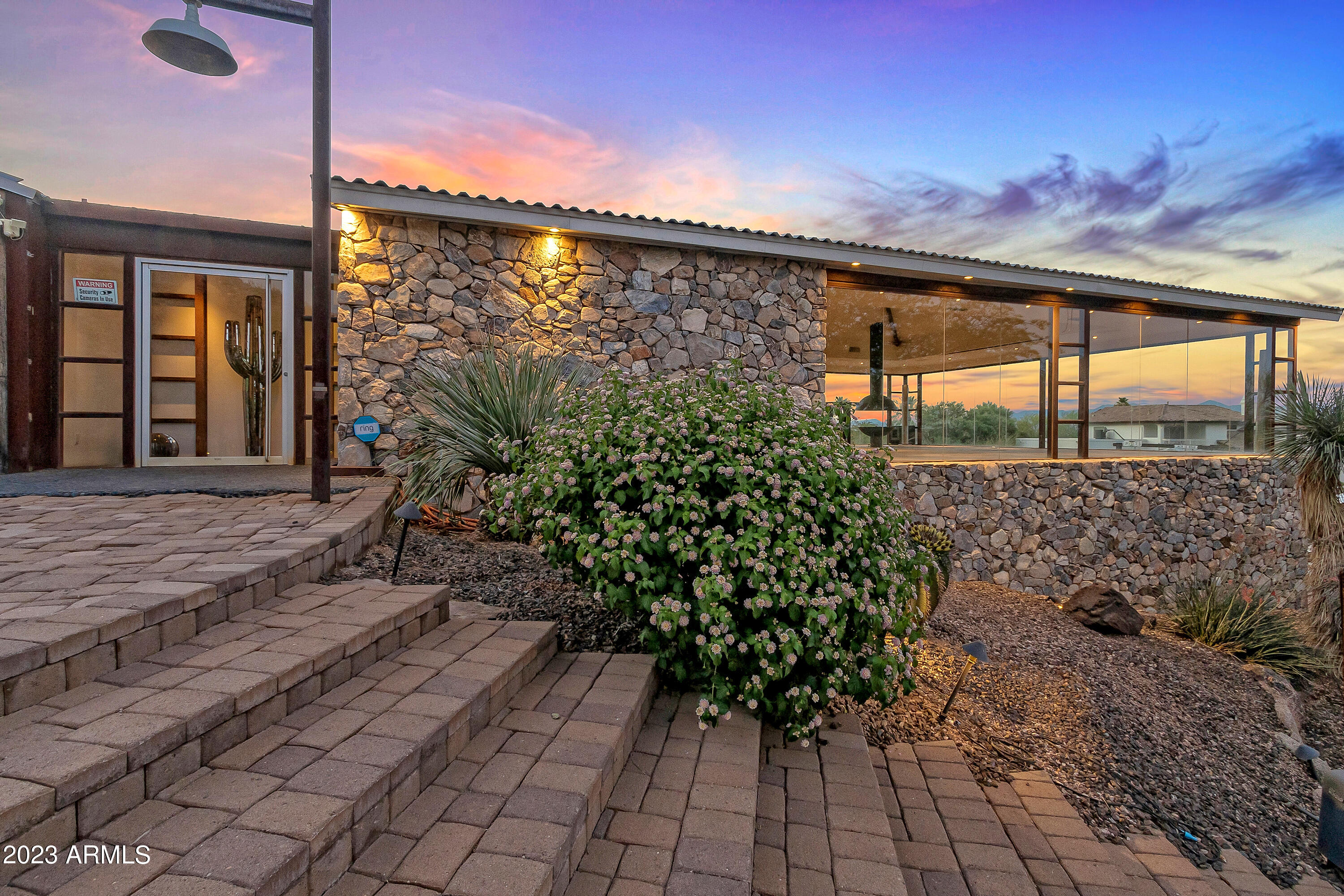 Incredible and rare opportunity to own on Camelback Mountain. Wake up to a direct view of the sun rising over the Four Peaks and evening views of the city lights below with the Talking Stick Casino lights dancing in the distance.  This luxury unique ranch style home has an exquisite chef's kitchen featuring Poggenpohl Cabinetry and Wolf and SubZero appliances.  Huge entertainment open concept space with a bar area and fireplace to enjoy the breathtaking east facing views from the floor to ceiling windows overlooking Paradise Valley & Scottsdale. The property is close to hiking, golf courses, shopping, amazing restaurants, and Scottsdale night life.